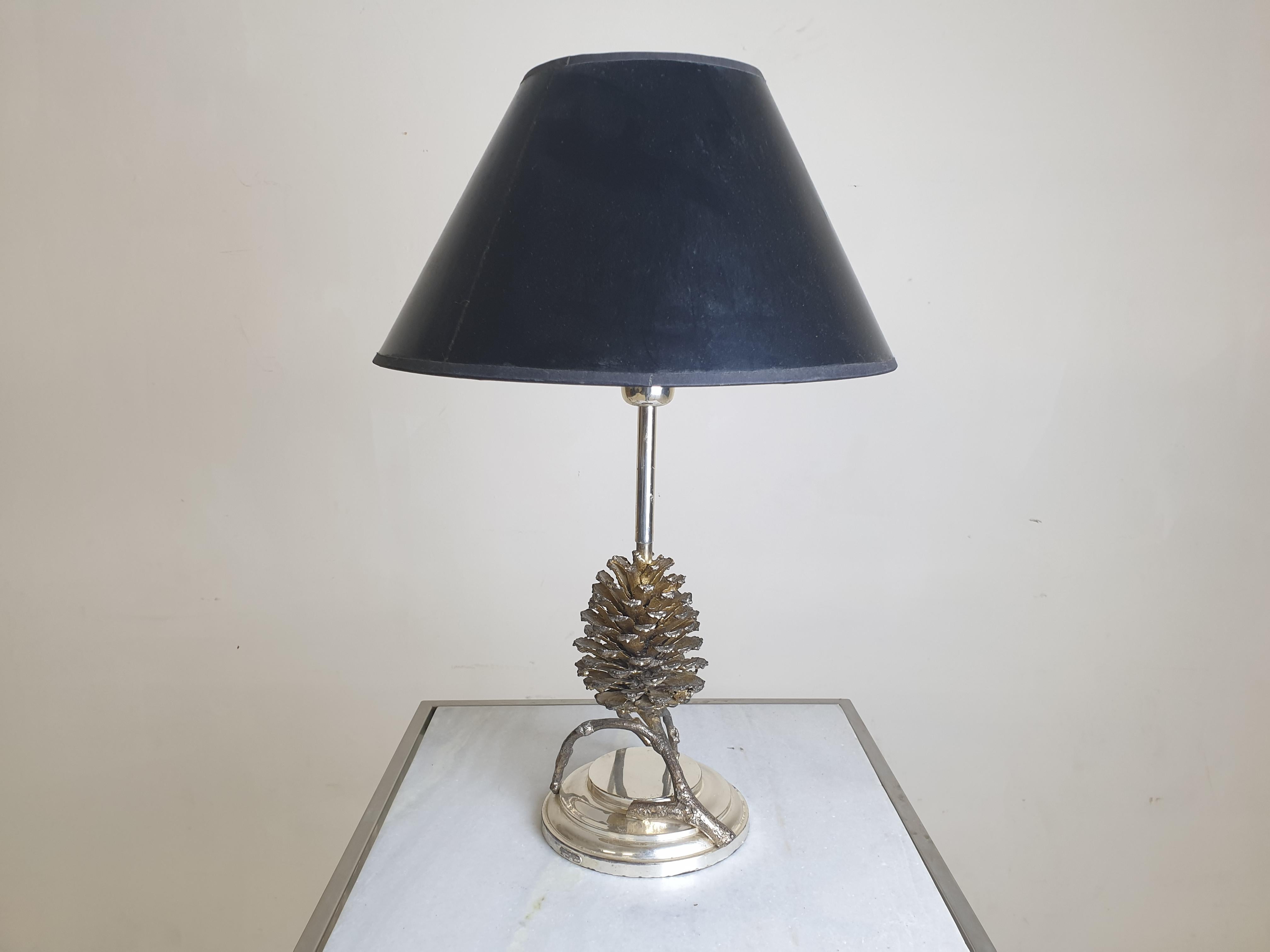 A luxurious, high-quality table lamp, made by Franco Lapini in Italy in the 1970s.

Franco Lapini is a maker of luxury items. Everything is made by hand and is a unique object.

Our lamp is a pine cone made of bronze on a silver-plated base. The