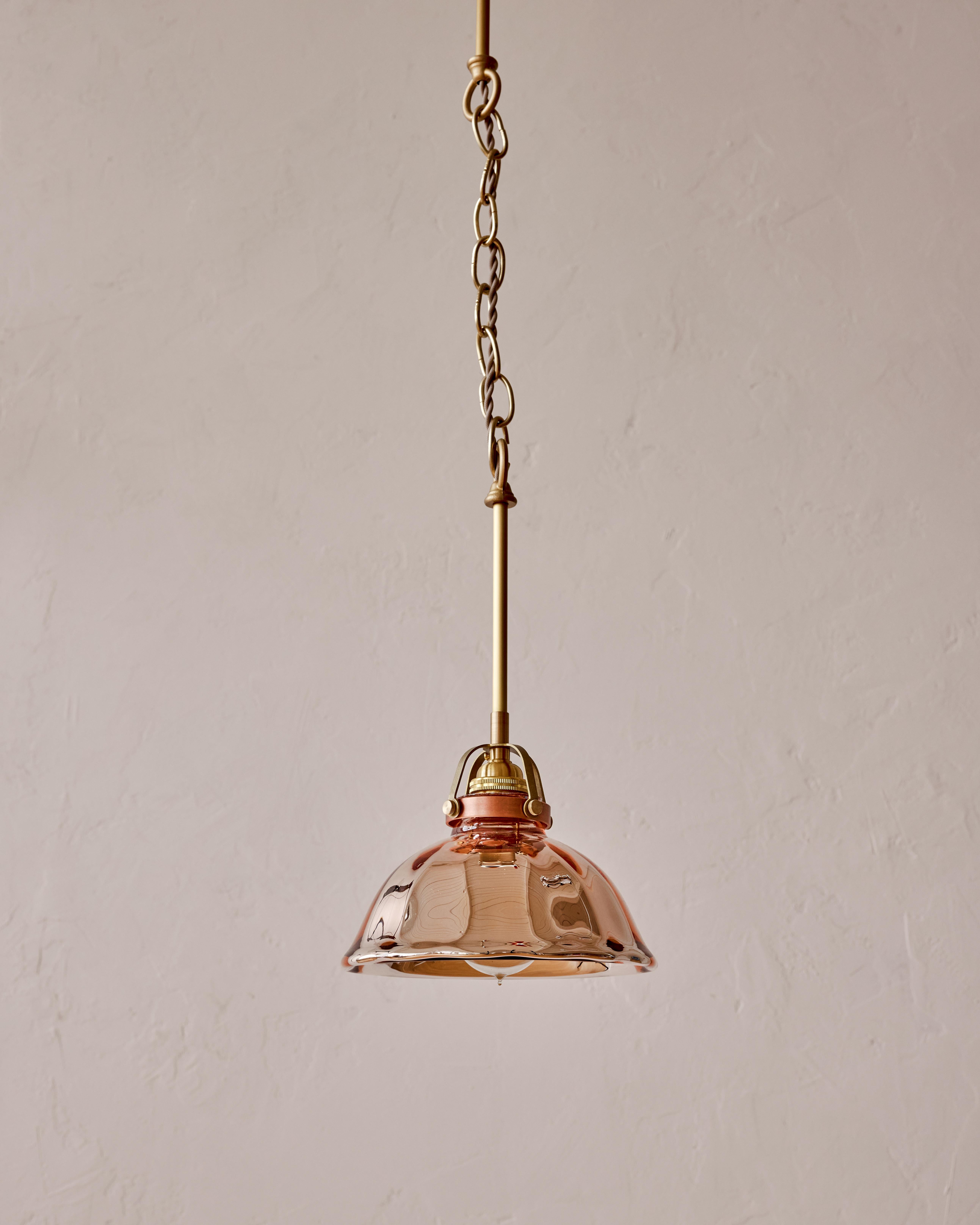 Our beautiful, limited edition rose pendant light is ready to illuminate your home with its soft warm light. The pink glass shade is 'mercury' silvered glass. This glass is blown double walled, then silvered between with a liquid silvering solution,