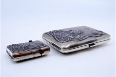 Silver planter with two suspended containers and cups, smooth body with cutouts