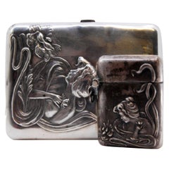 Silver planter with two suspended containers and cups, smooth body with cutouts