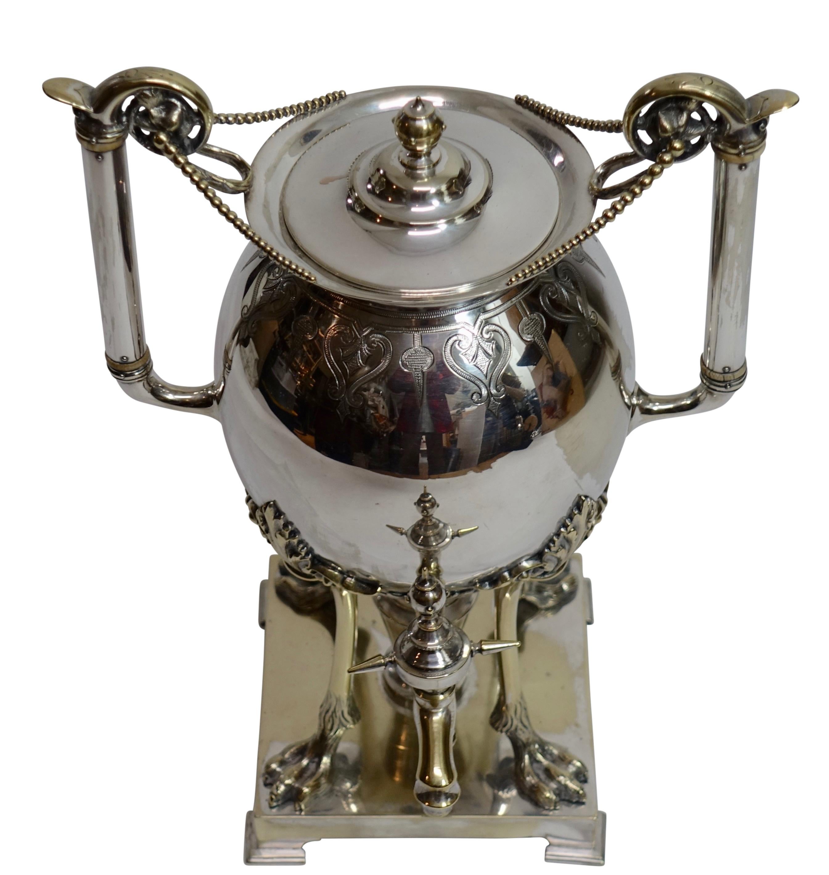 An Aesthetic period silver plate on brass hot water urn samovar. Wonderfully detailed and a very fine example of this style. American, late 19th century (1875-1890). 
Made by Manhattan Plating Co. N.Y.