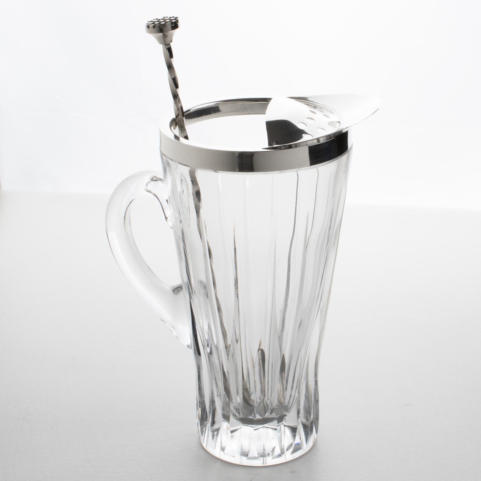 An elegant French 1940s barware Martini cocktail pitcher set. Modernist design with a molded crystal jug topped with a silver plate strainer and pourer. Long silverplate spoon/stirrer to mix the cocktail. Marked in the strainer with legal