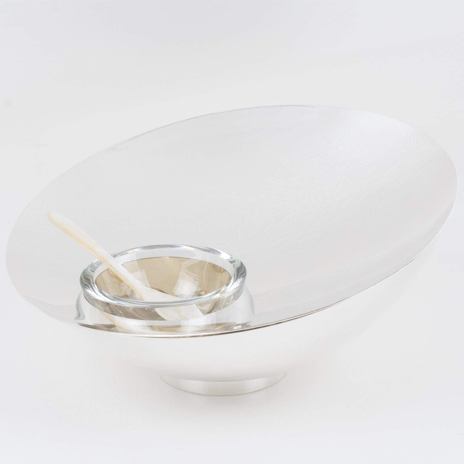 Stylish modernist three-piece set including one bowl, a tray insert, and a crystal bowl insert with a mother-of-pearl spoon, designed circa 1980, by Nan Swid for SwidPowell and known as the 