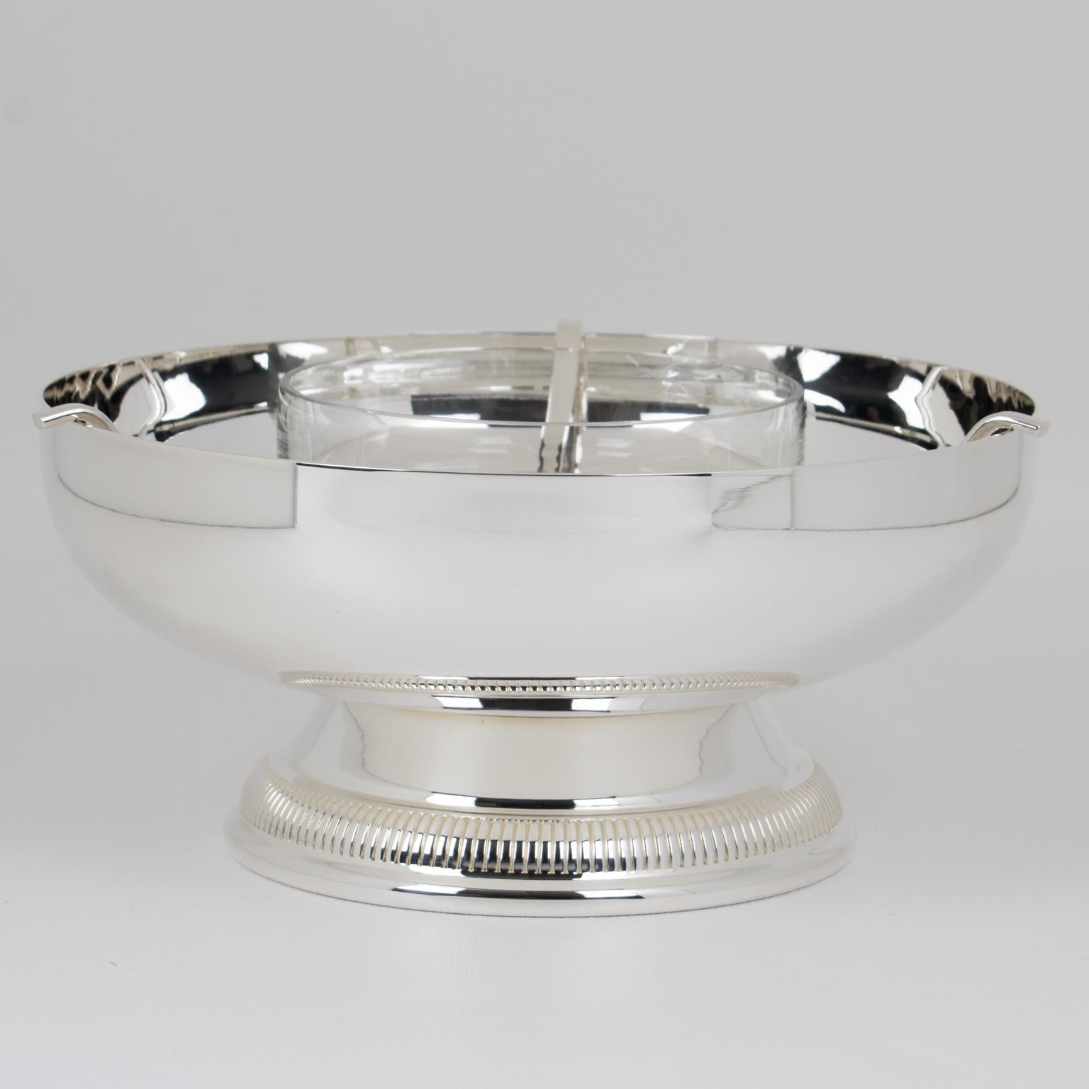 A modernist silver plate and crystal caviar serving bowl, dish, or chiller designed by French silversmith Gelb in the 1980s. Sophisticated design with a streamlined geometric shape, featuring a rounded silver-plated metal ice container and support,