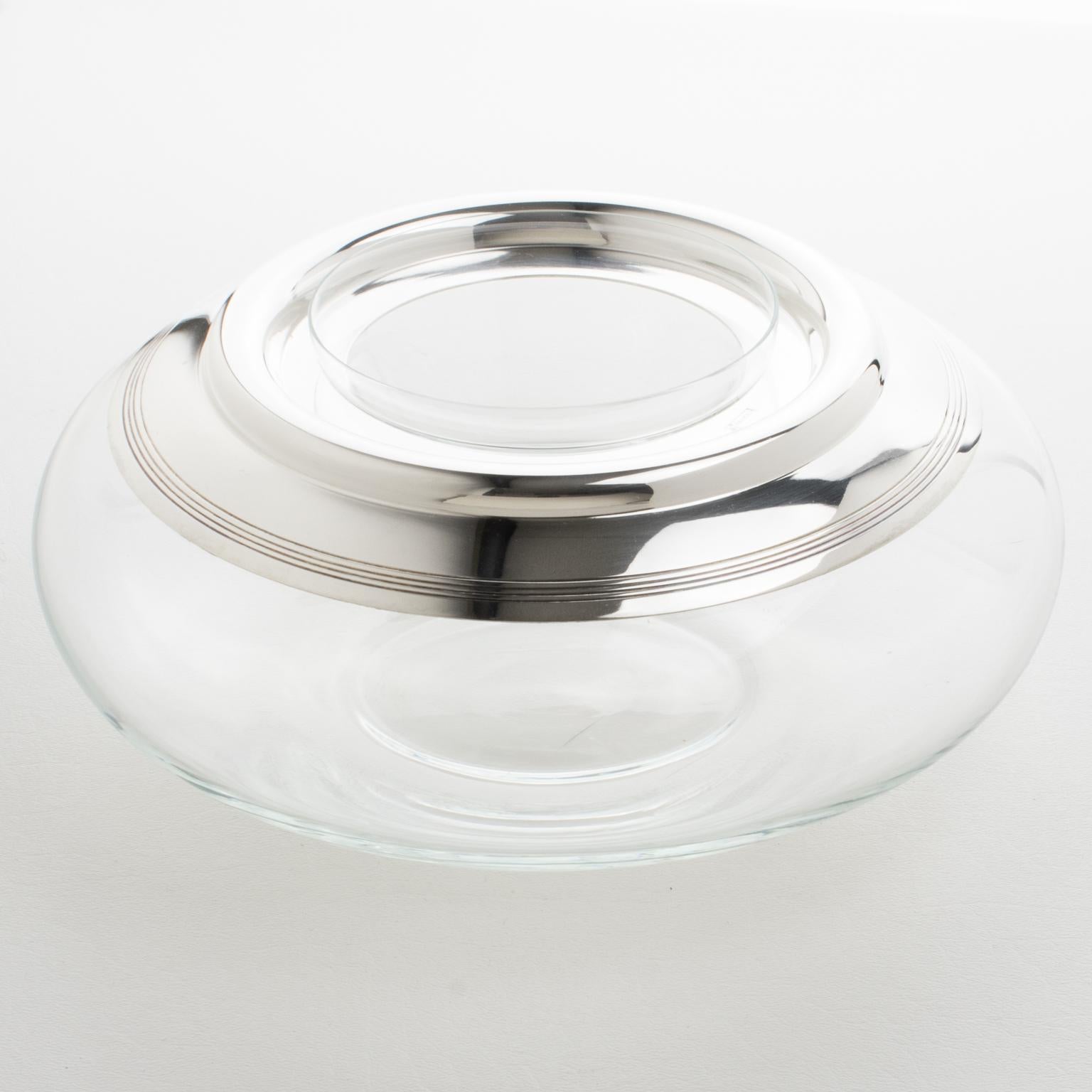 French silversmith Saint Hillaire designed this sophisticated Mid-Century silver plate and crystal caviar serving bowl, dish, or chiller in the 1960s. The chic design has a geometric streamlined shape, featuring a generous puffy crystal container