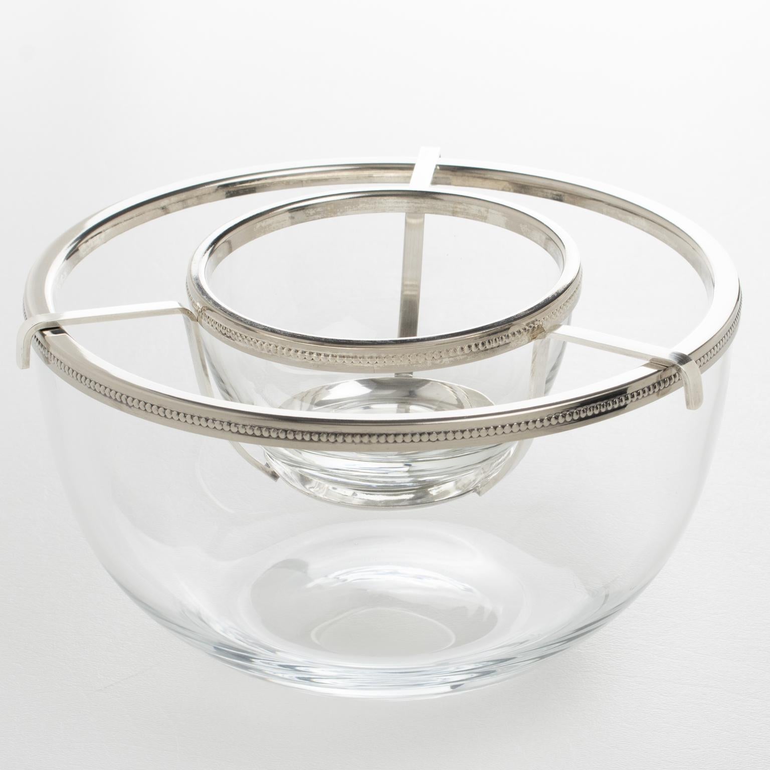 The French silversmith AMO designed this stylish modernist Mid-Century silver plate and crystal caviar serving bowl in the 1970s. The streamlined chic design of this dish chiller has a rounded shape, featuring a large crystal container with a