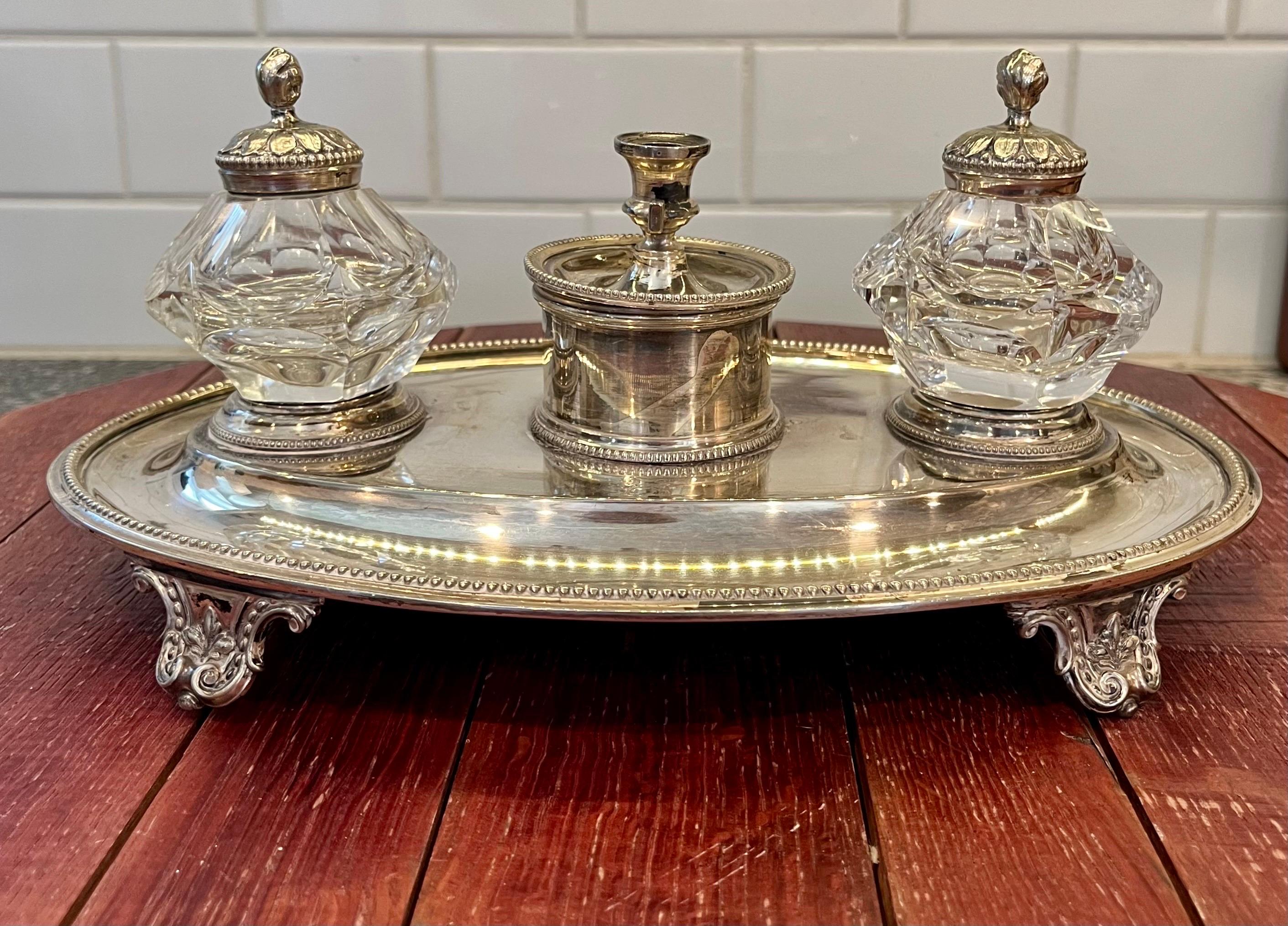 Stunning ink stand in Georgian style. Silver Plate and Crystal or cut glass ink wells. Candle holder to light the way. Stamped with makers marks. 