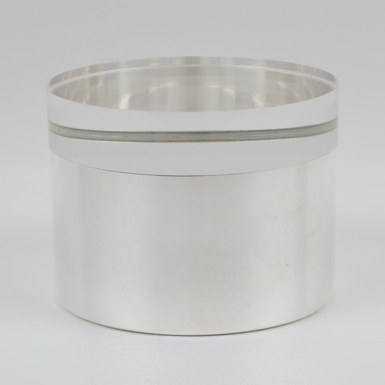 This lovely decorative box by Debladis Paris was designed in the 1960s. The rounded shape boasts a silverplate base and an extra thick lid in crystal clear Lucite. The piece is marked underside with legal silversmith hallmarks.
The box is in good
