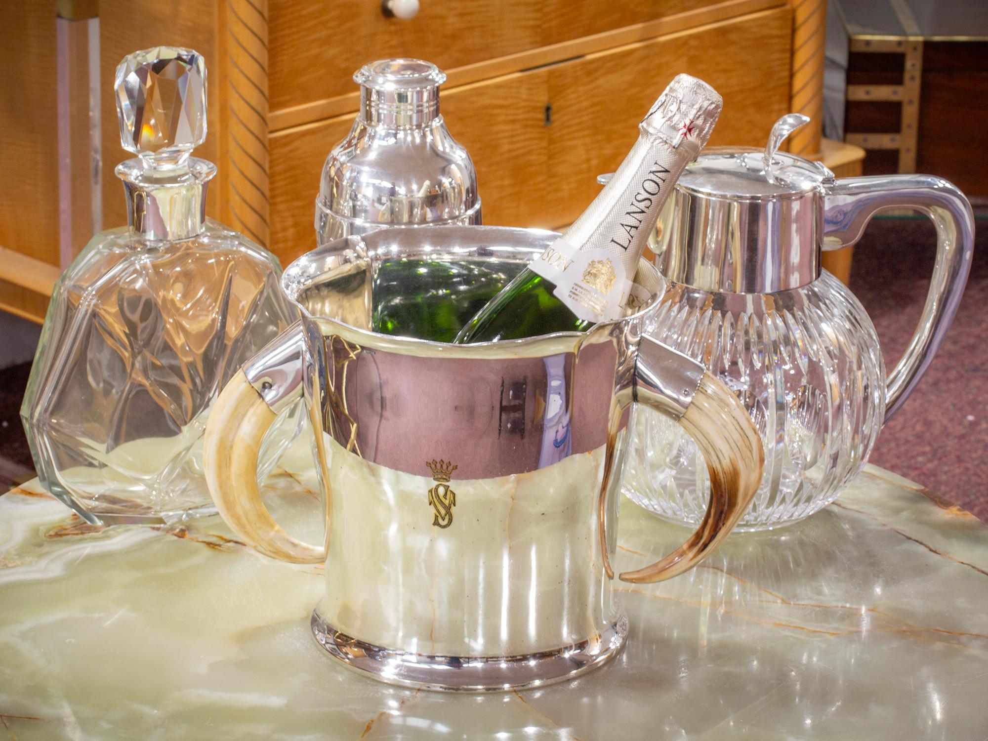 With Twin Boar Tusks

From our Barware collection, we are thrilled to offer this Silver Plate Boar Tusk Champagne Bucket. The Champagne Bucket mounted with twin Boar tusks around a flared Silver Plated bucket. The front of the Champagne Bucket
