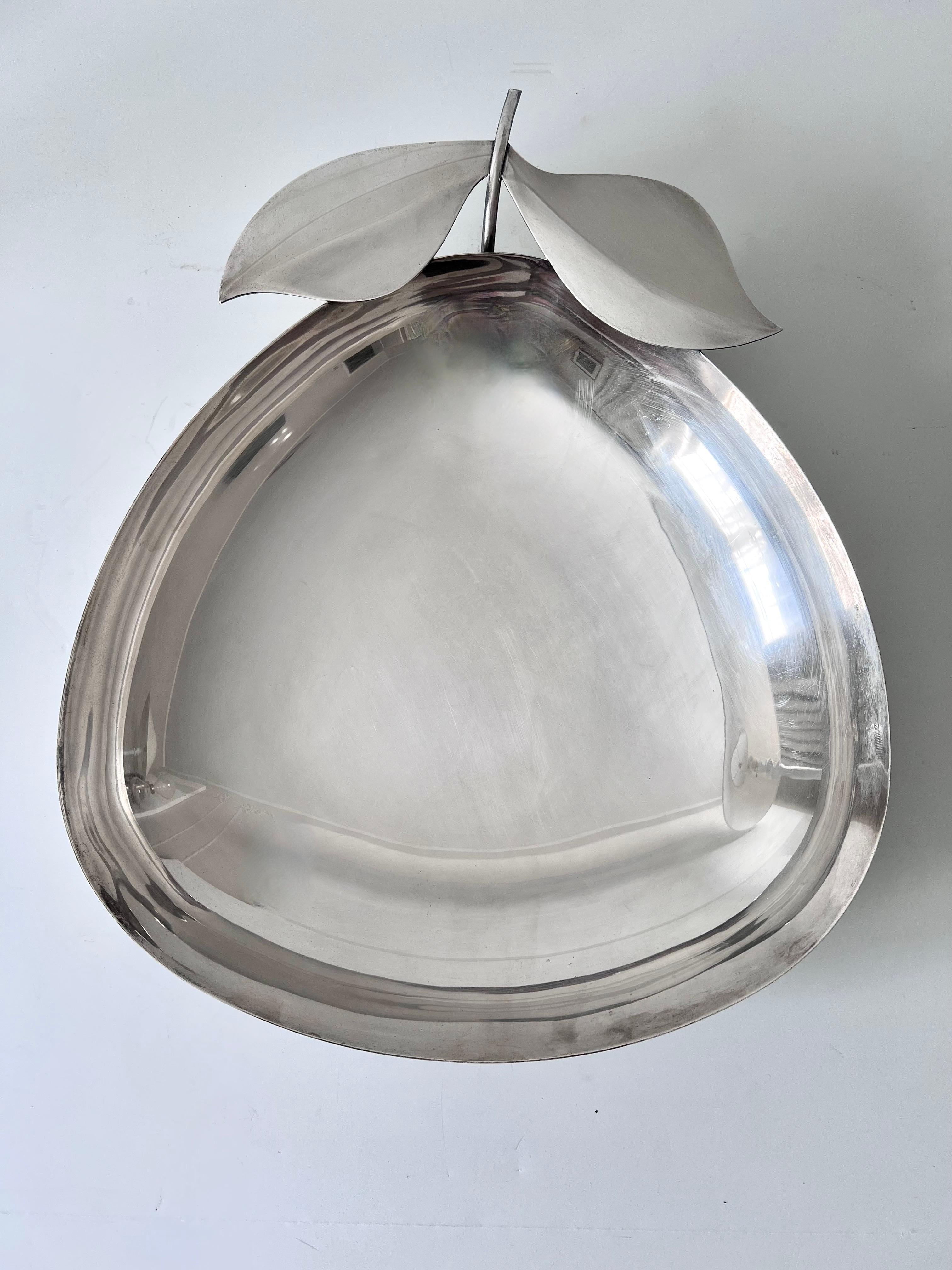 Acquired in Paris, France - a lovely silver plate bowl in the shape of an apple or piece of fruit... a compliment to any cocktail table, the bar, as a serving piece or simply to display. Also a lovely piece to float flowers in. The subtle and