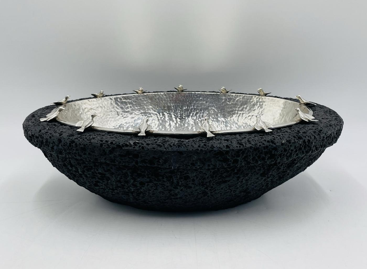 Enhance your dining experience with this exquisite Silver-Plate Bowl with Bird Detail on a Volcanic Rock Bowl by Emilia Castillo. 
The piece is hand crafted in Taxco Gerrero in the Emilia Castillo workshop by skilled artisans.
Crafted with precision