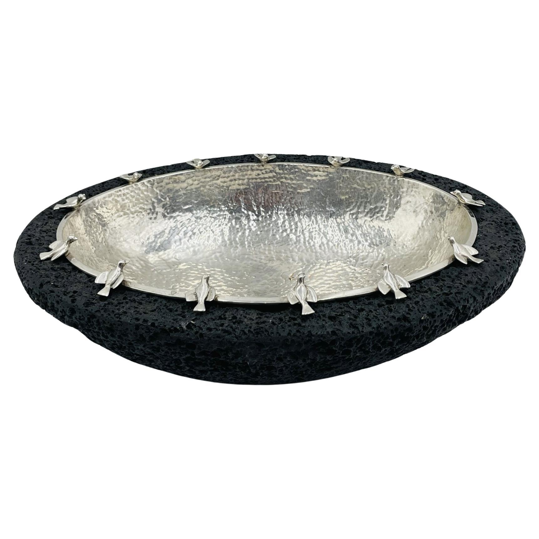 Silver-Plate Bowl with Bird Detail on Volcanic Rock baseby Emilia Castillo