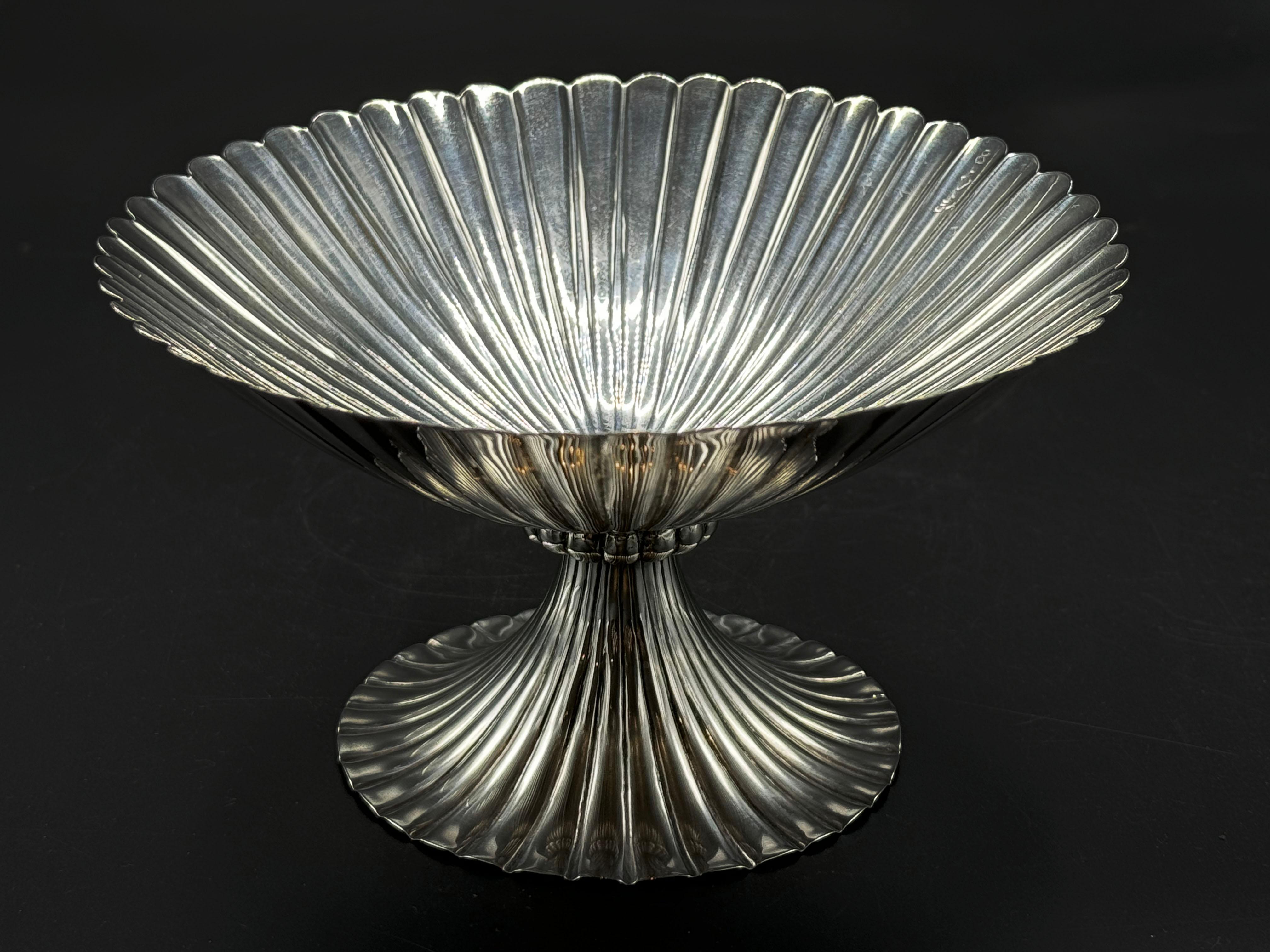 A hand-carved silver bowl, hallmarked on the bottom. In the style of the Wiener Werkstätte, Vienna workshop, designed by Josef Hoffmann Austria, circa 1920.

Height: 16.5 cm (6.49 in)
Diameter: 10 cm (3.93 in)