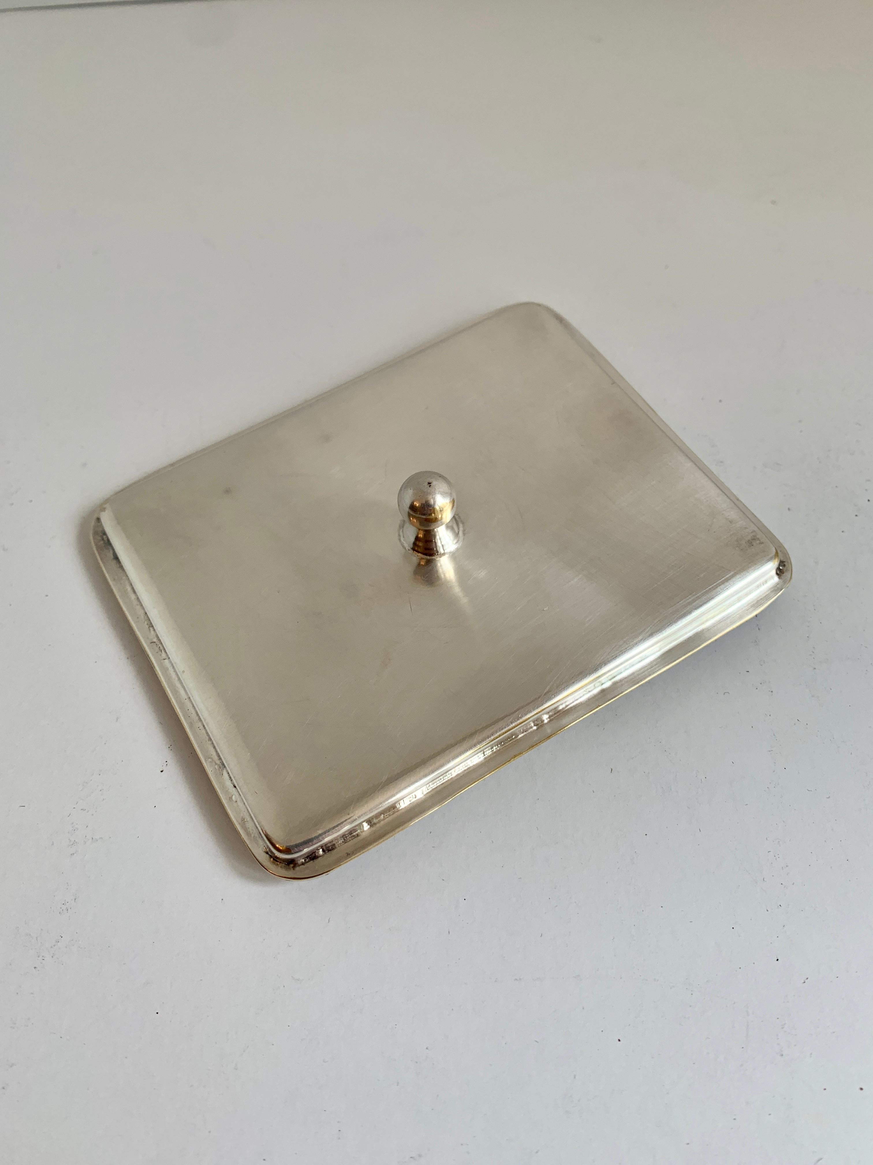 This very slim and uniquely designed card holder looks to have been for, perhaps, signing a bill or statement at a hotel or fine club - the trim is lovely. Silver plated and made in Argentina.