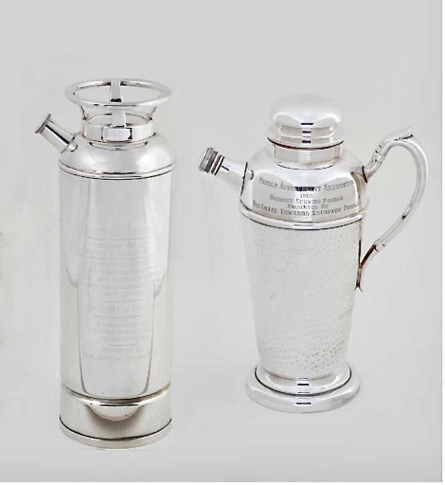 This is a charming large mid-century silver plated cocktail shaker in the form of a fire extinguisher. The Extinguisher has been extensively engraved, which only enhances the unique form of the shaker. The shaker is in overall very good condition.
