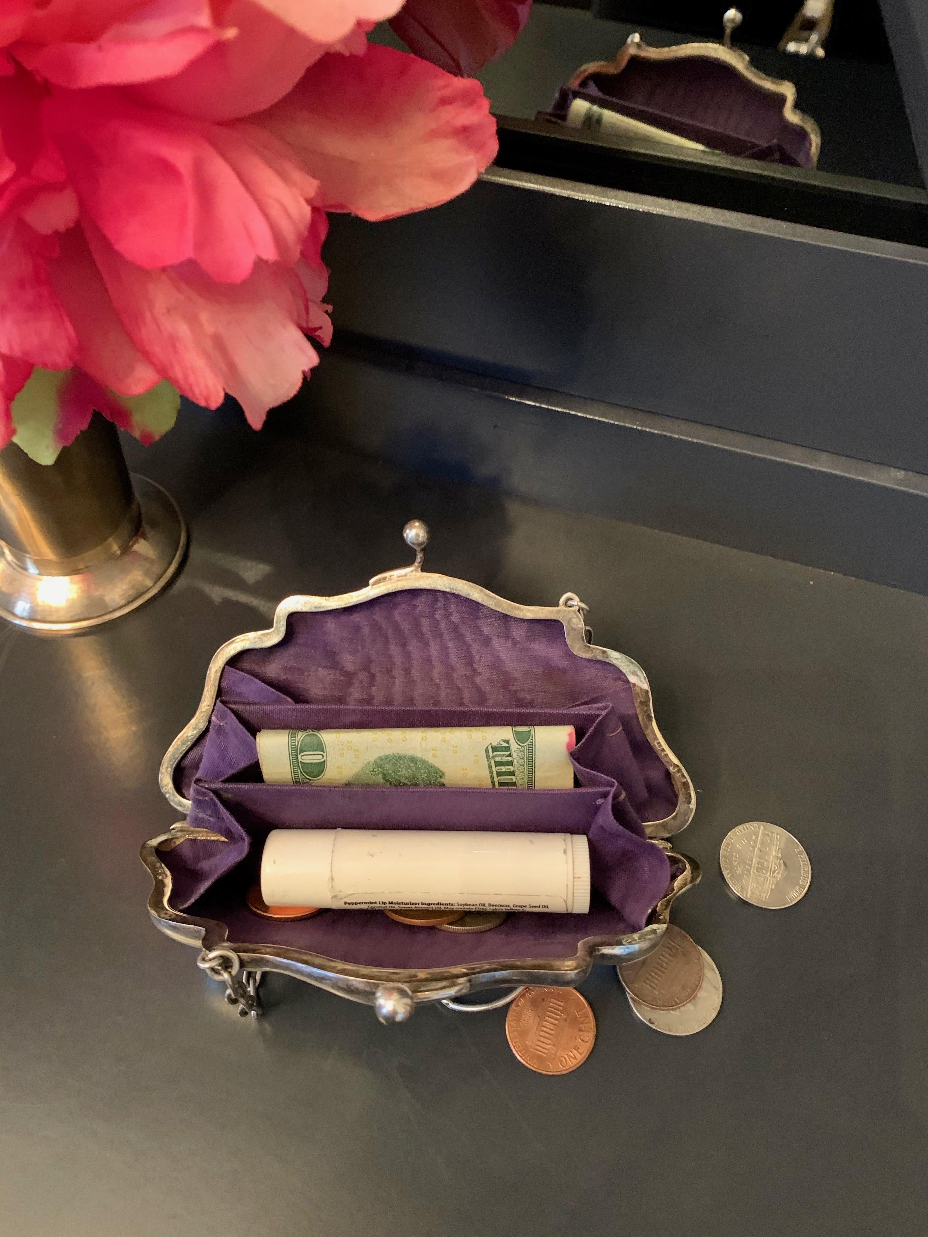 Silver plate coin purse with three sections for change, money, lipstick, etc. perfect for the man or woman that enjoys carrying a small but efficient piece.
Chain handle or clutch

Aubergine satin lining in very good condition.