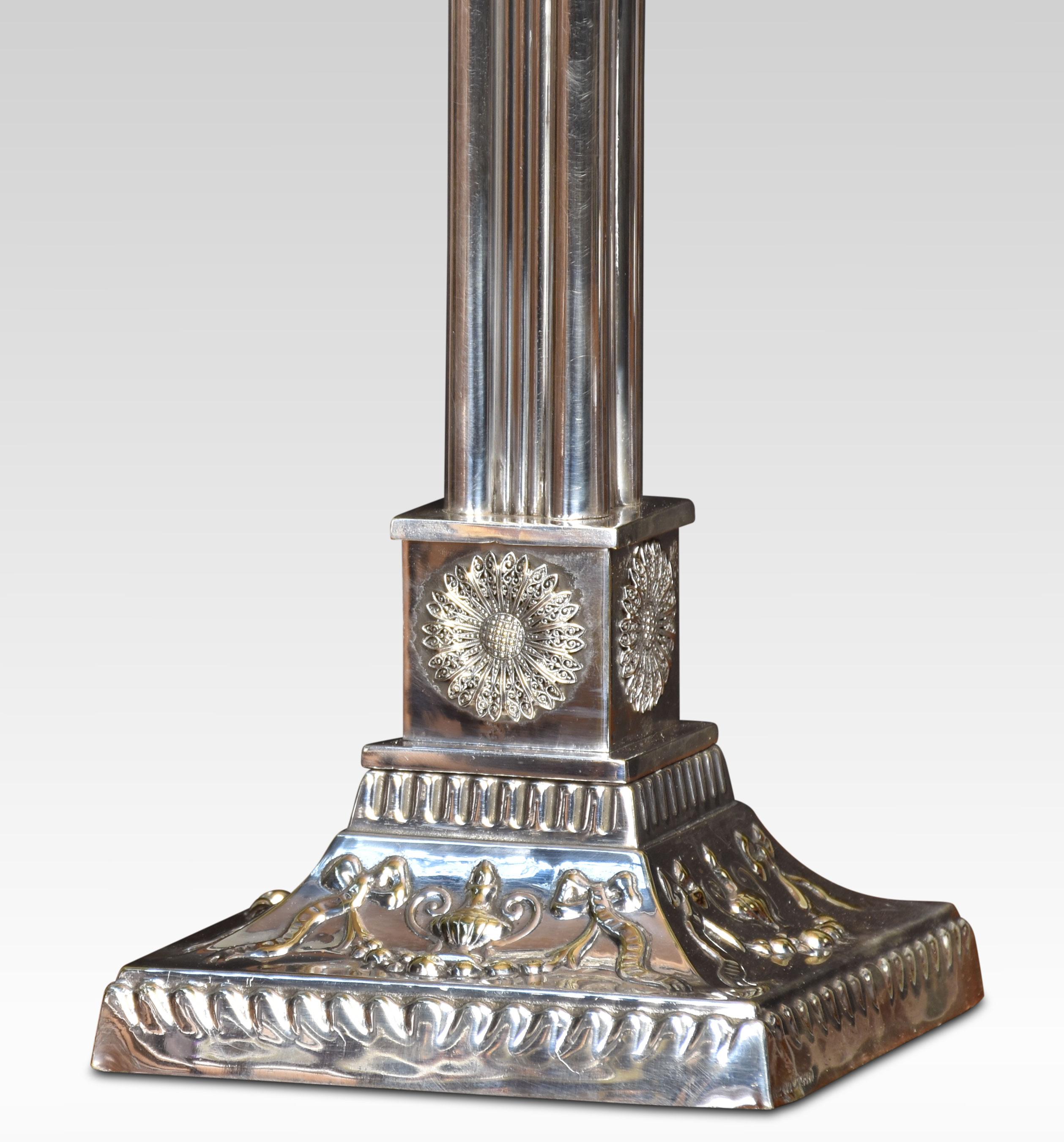 Silverplate table lamp, having a Corinthian column on an embossed square base with flower head detail. The lamp has been rewired.
Dimensions
Height 17 inches
Width 6.5 inches
Depth 6.5 inches.