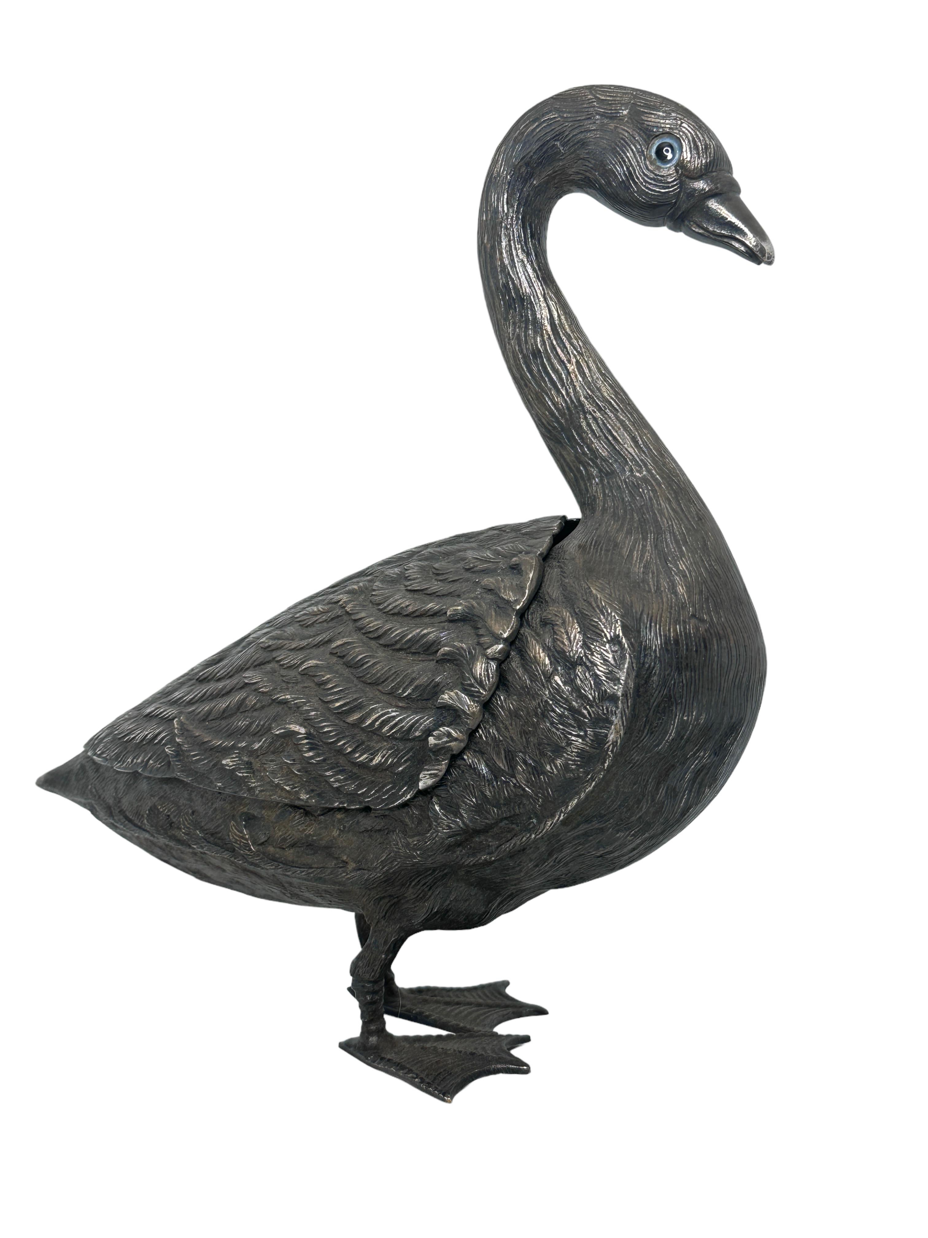 A stunning addition to any room or table. Exquisite form and finely detailed feathers etched with precision into silver-covered metal. Combine whimsical romanticism with streamlined elegance and conjure up the magic of antique European tales. We