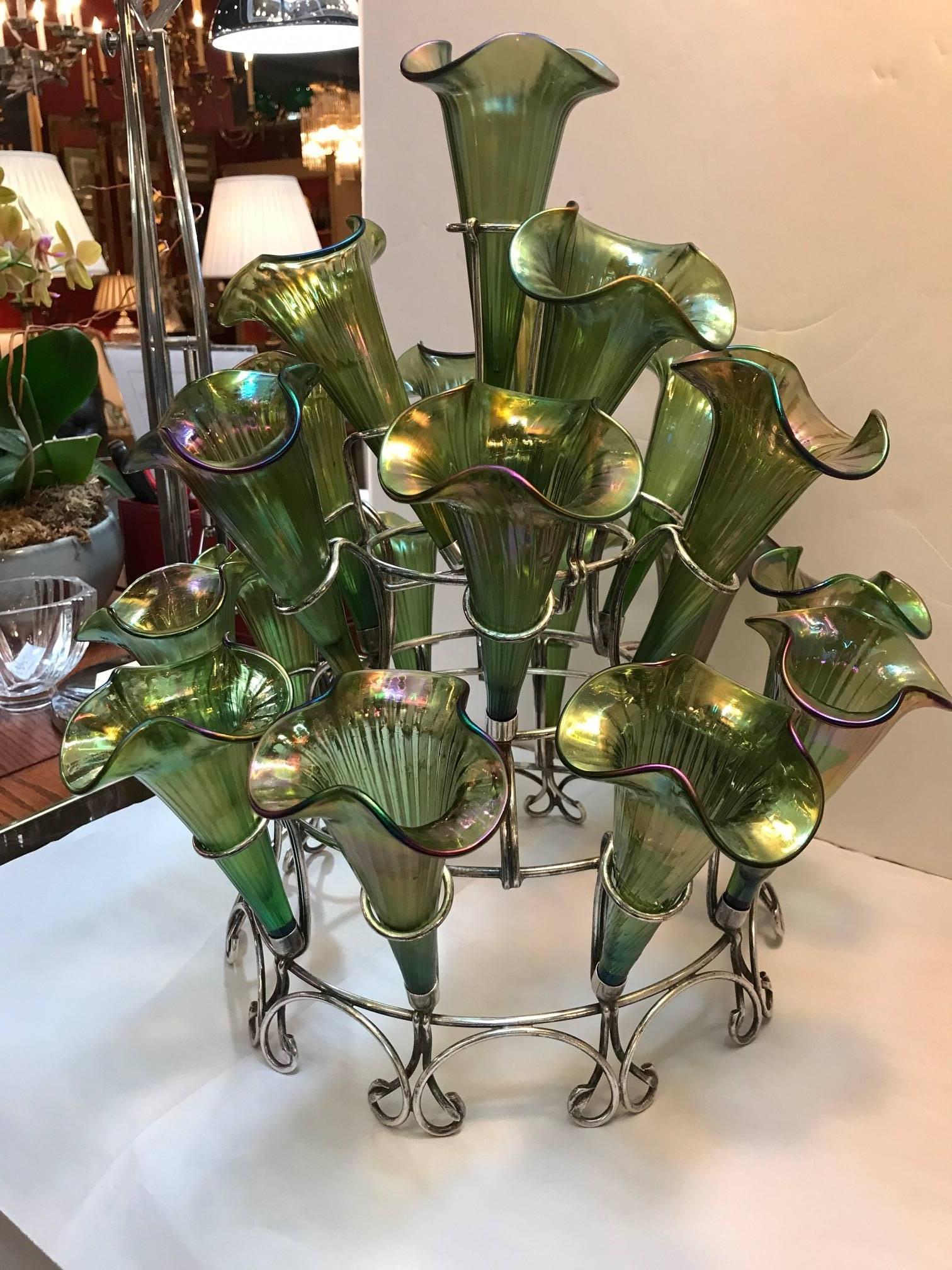 Impressive Epergne with 20 Loets glass flutes. An iridescent finish on each floral trumpet shaped insert.