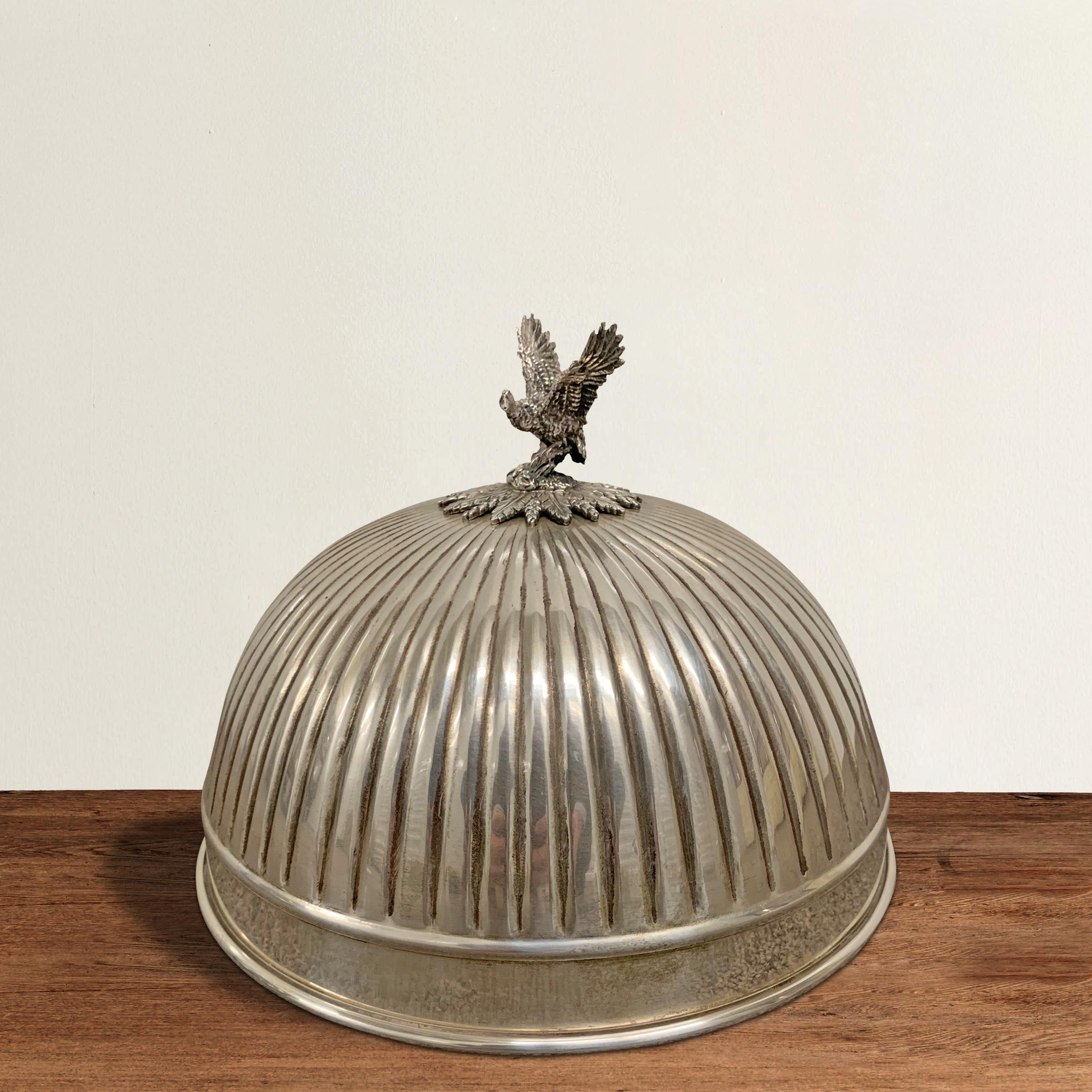 A whimsical food dome with a reeded surface and a finial depicting a mallard duck getting ready to take flight. Five available.