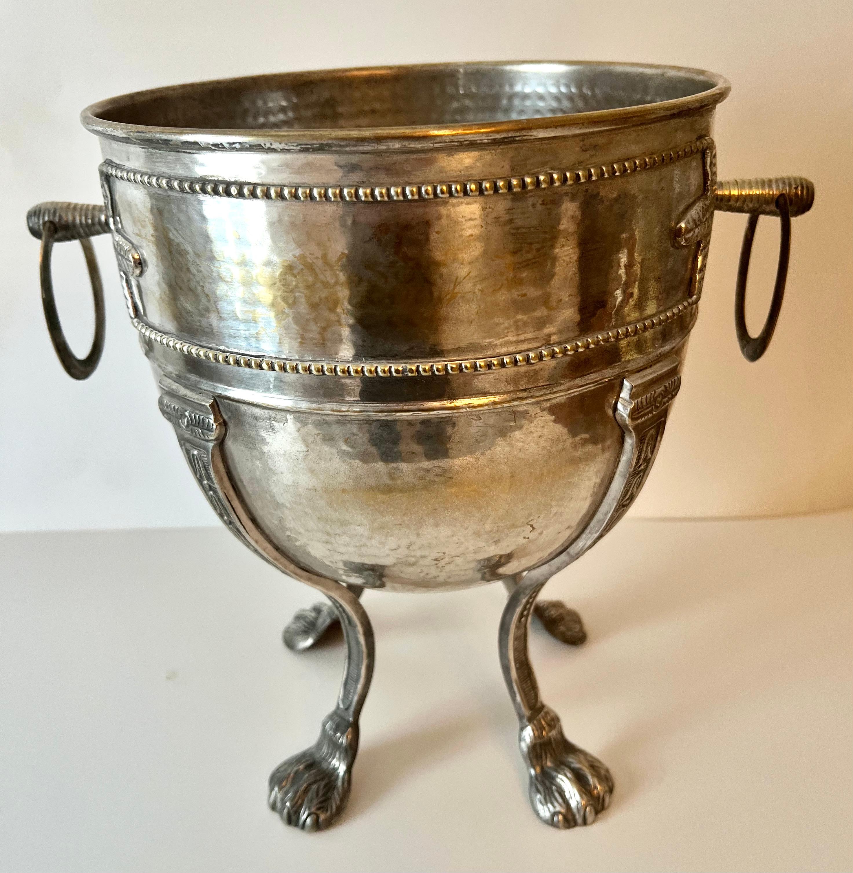 Uniquely detailed Silver Plate Jardiniere or Planter the also makes a fantastic Champagne chiller or ice bucket. The details are wonderful with side handles and a beautiful patinated finish.

A compliment as a planter with a lush plant, or for