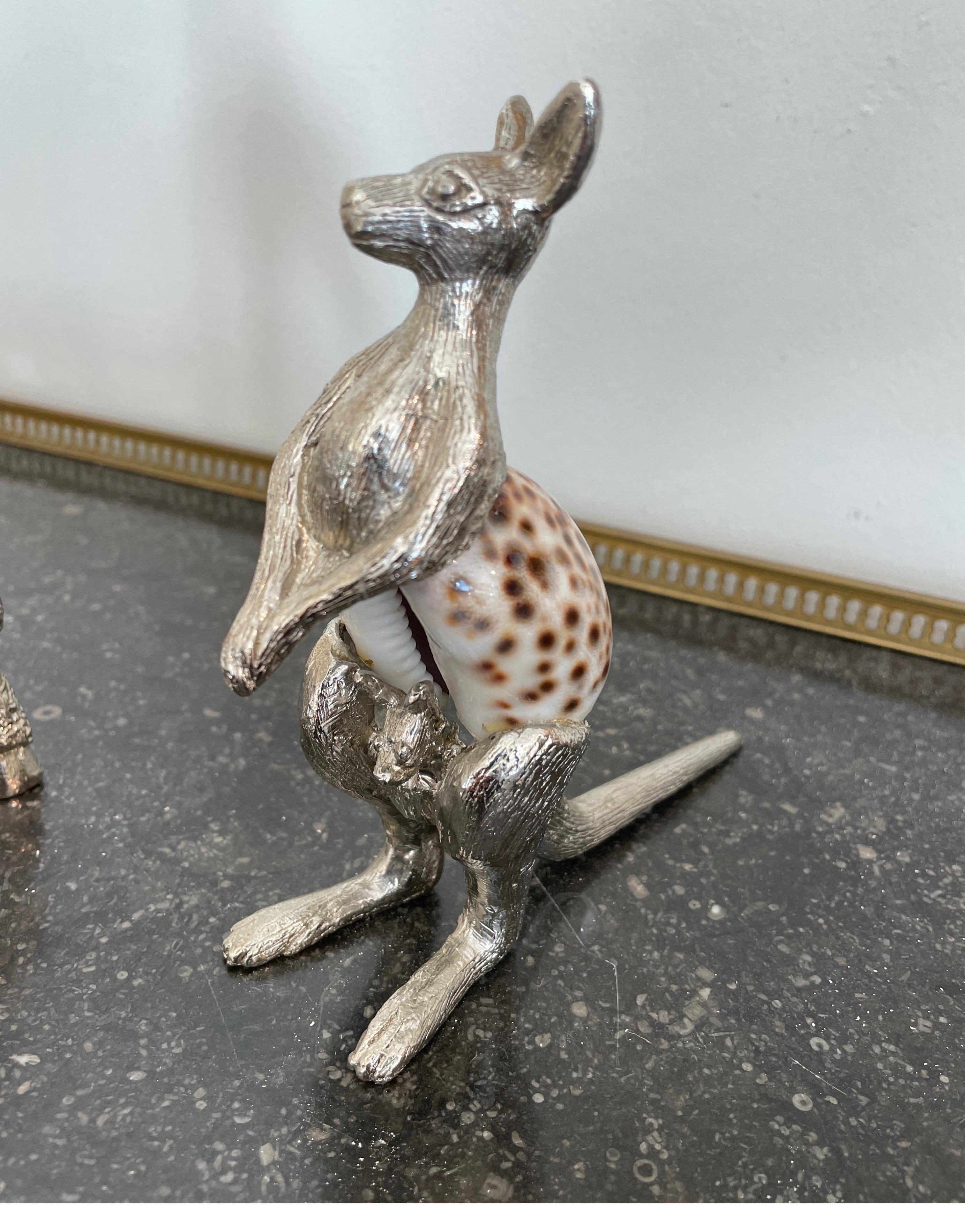 Pair of silver plate figurines of a Giraffe & Kangaroo with shell bodies.