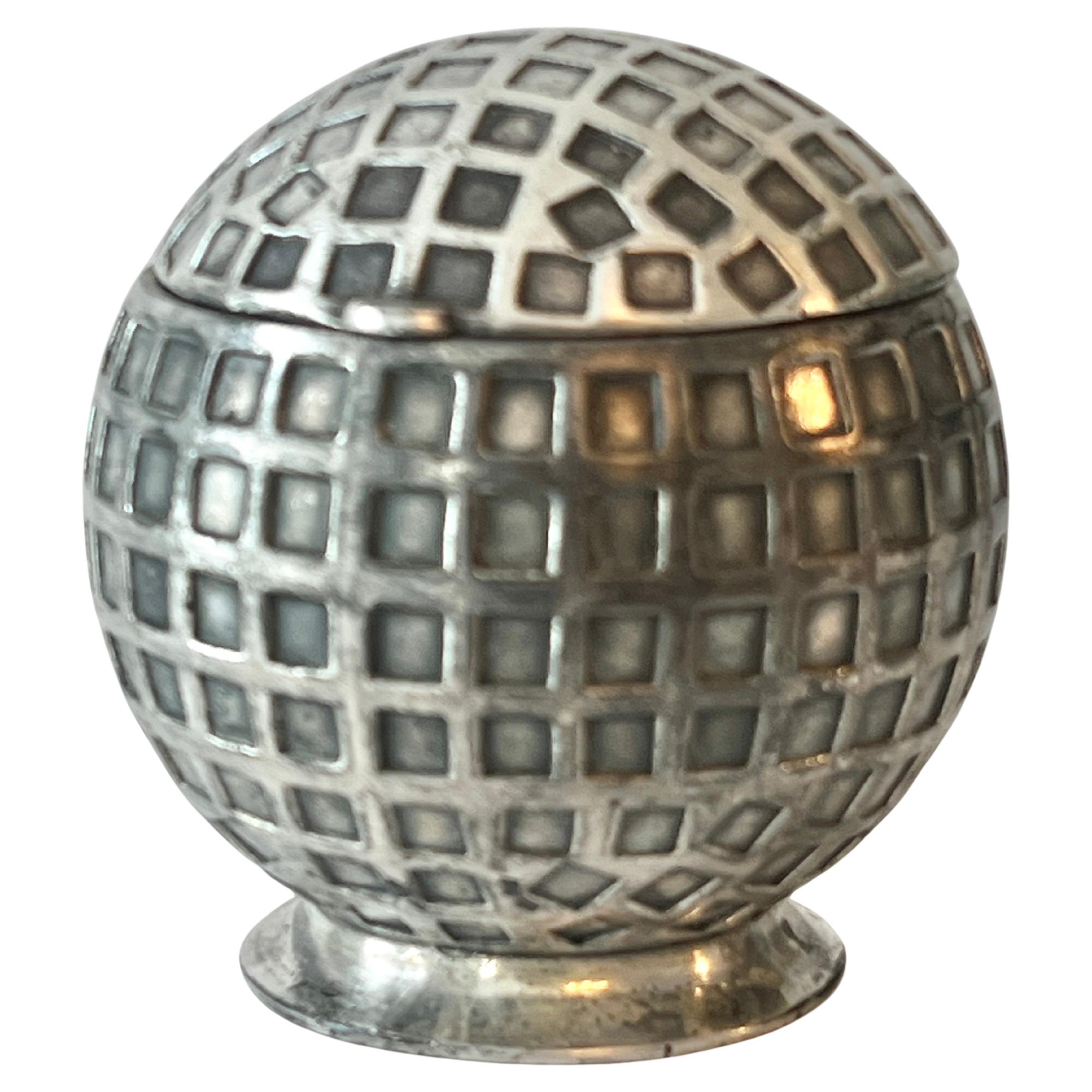 A handsome Silver Plated Golf Ball, which at one point was an Inkwell with a glass insert.  The glass, while could be substituted, is no longer with the piece. 

We believe the Golf Ball Nod, is the perfect Desk Accessory for the golf aficionado! 