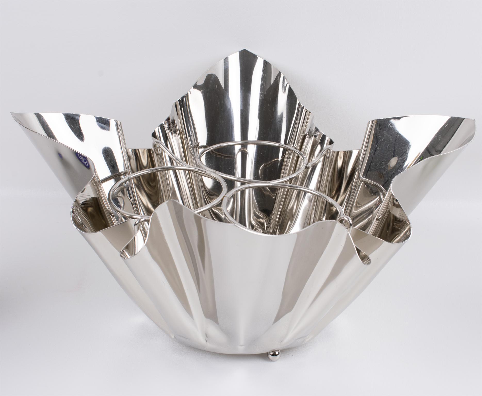 Make a bold statement with this stunning mid-century modern silver plate wine cooler or champagne ice bucket, expertly crafted in France circa 1960. A true conversation piece, this ultra-chic bar essential captivates with its whimsical