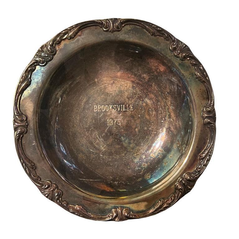 A beautiful collection of American Classical equine horse race trophy silver plate bowls. This beautiful set of 3 is from a variety of races from the 1970s. Each piece is engraved with the race and the date in the center of the dish. The edges of