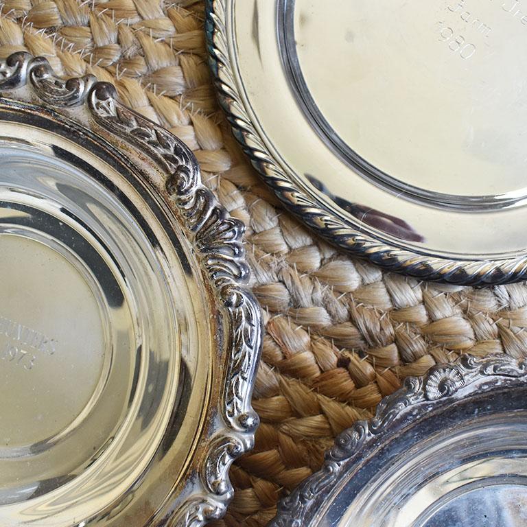 A collection of American Classical equine horse race trophy silver plate plates and bowls. This beautiful set of 13 is from a variety of races from the 1970s and 1980s. Each piece is engraved with the race and the date. This set would be beautiful