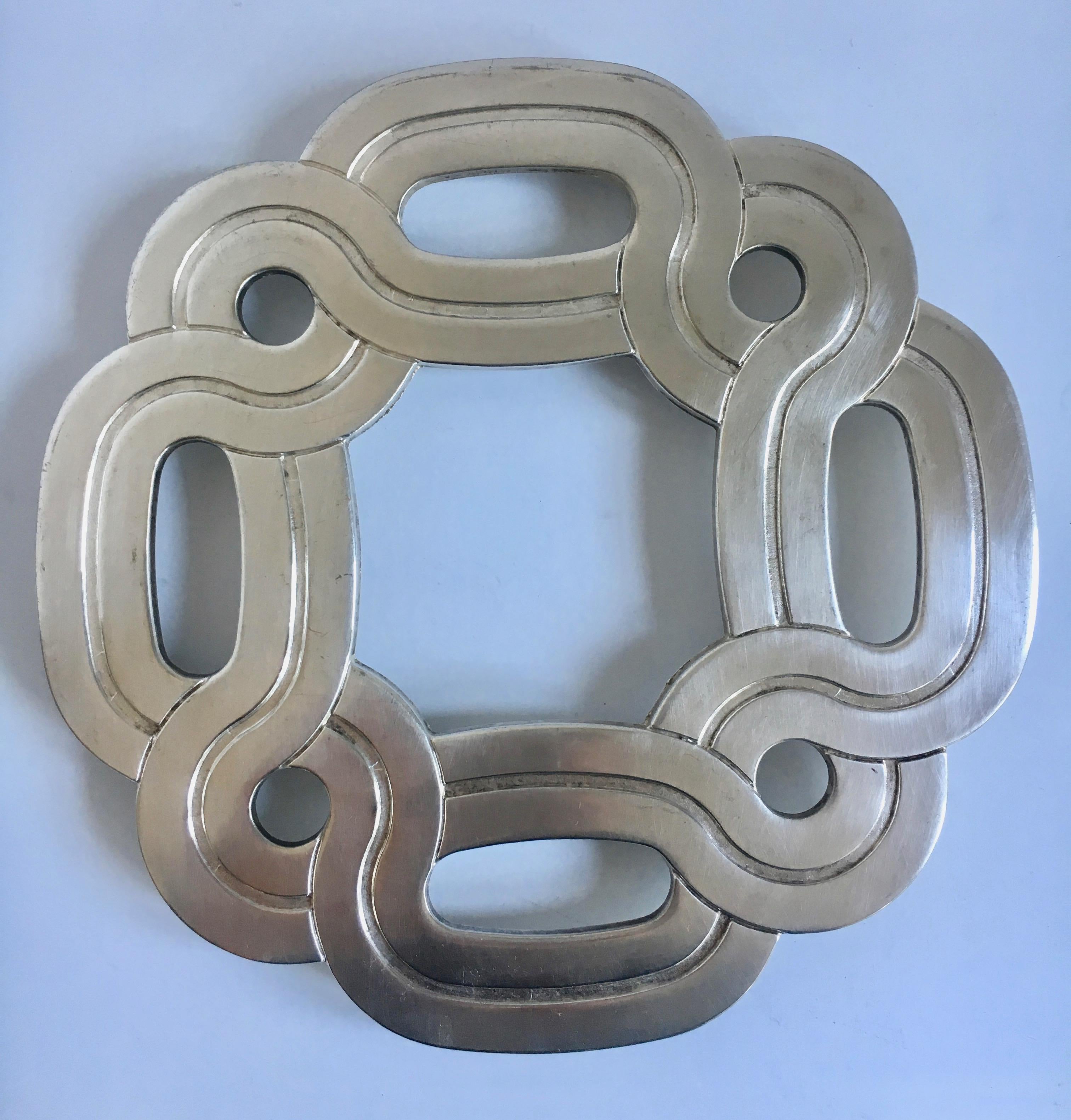 Silver plate Italian trivet - a great decorative pattern, perhaps Celtic. no need to store as this will look great on your counter or hanging on your wall.