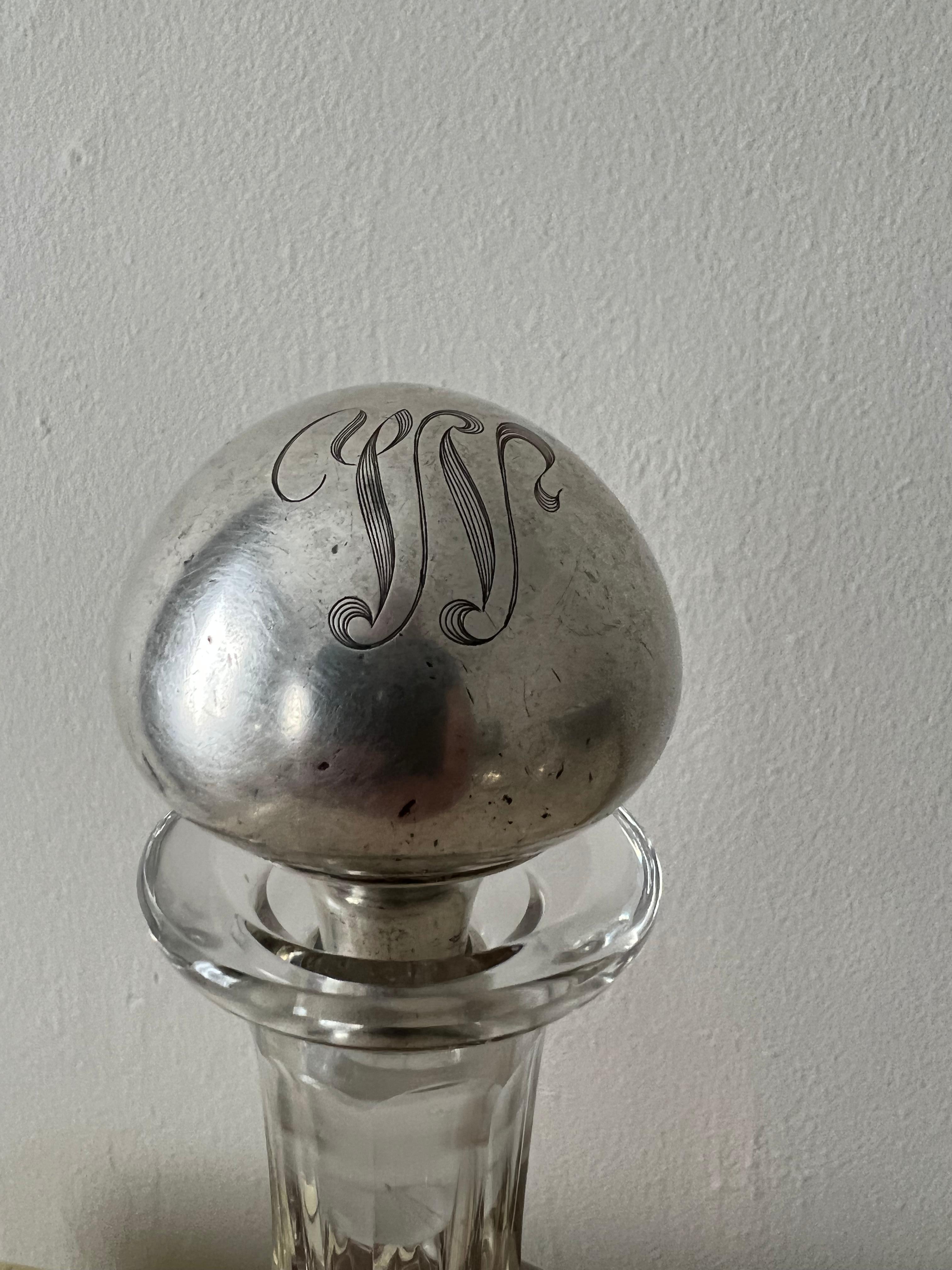 Sterling silver bottle stopper. Monogrammed with the letter W. The piece is wonderfully patinated from decades of unleashing spirits.
