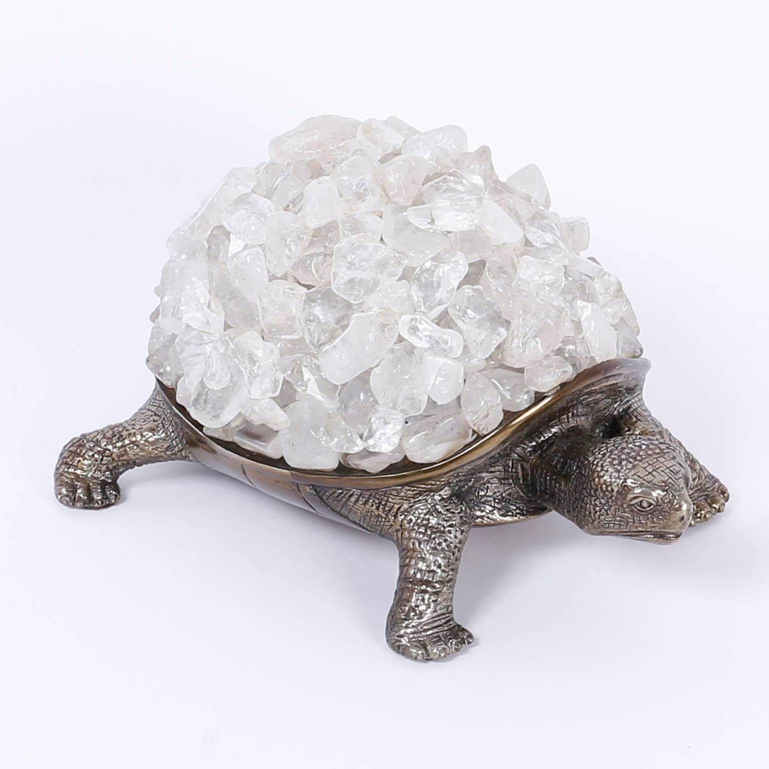 As a symbol of persistence, this silver plate on brass turtle is carrying a heavy load of quartz crystal stones with determination and destination. An object of art for the serious collector.

 