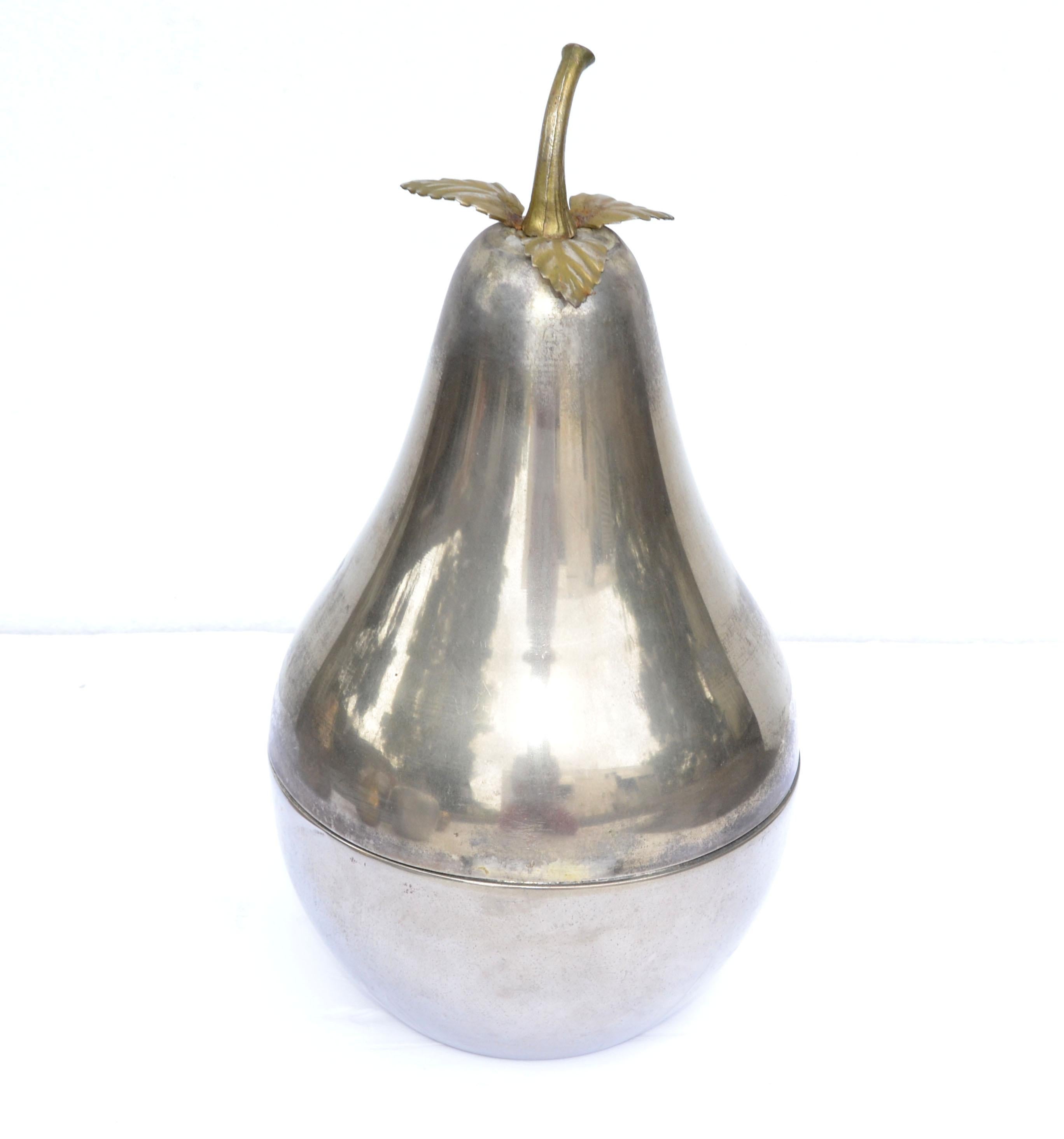 Superb ice bucket in the form of pear the silver plated over Nickel body with removable lid complete with naturalistic leaves and stalk.
All original condition with patina to the Metal. 
Please take a look at our large Collection of Mid-Century