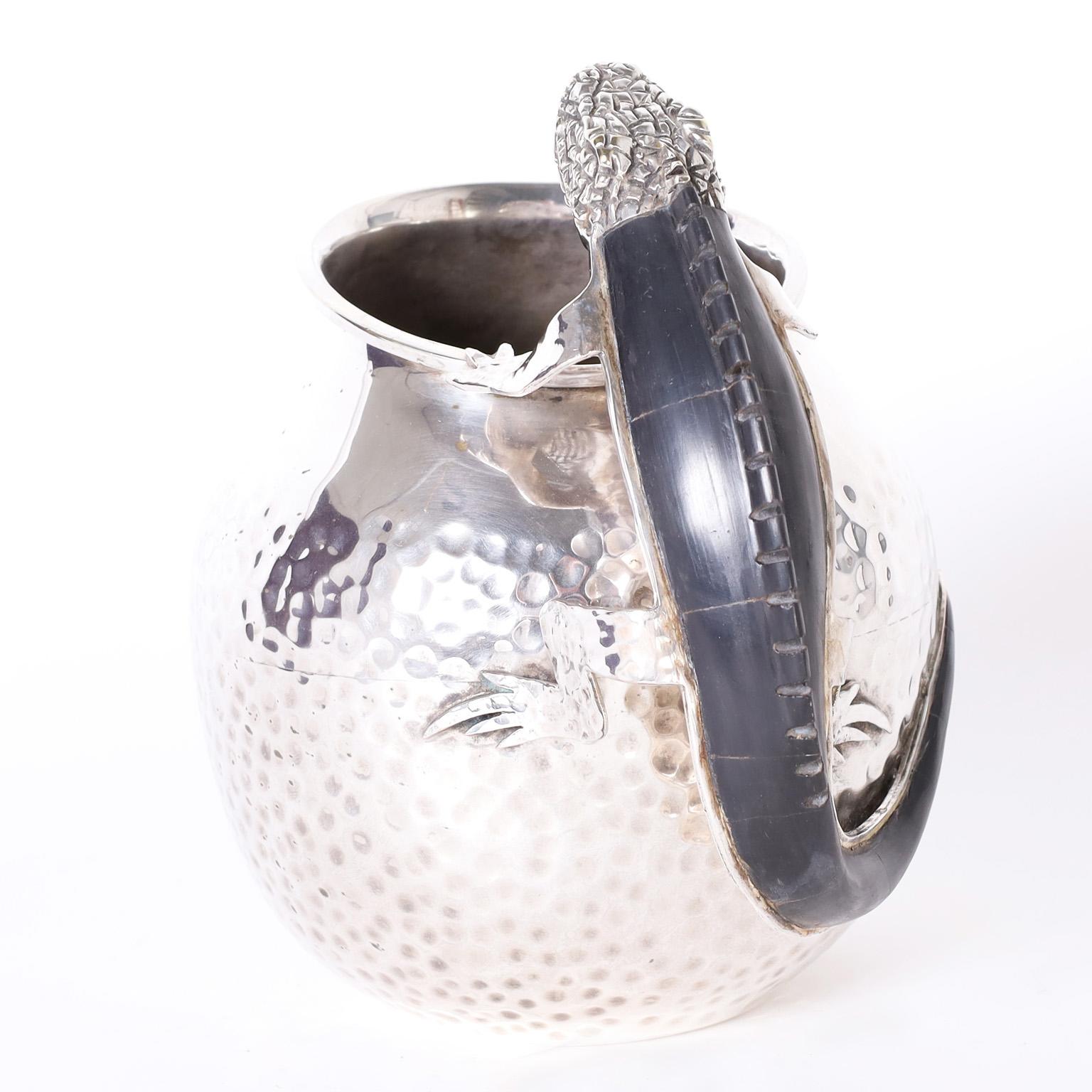 Eye catching mid century silver plate on copper hand crafted pitcher featuring a lizard handle with a black stone back. Attributed to Castillo.