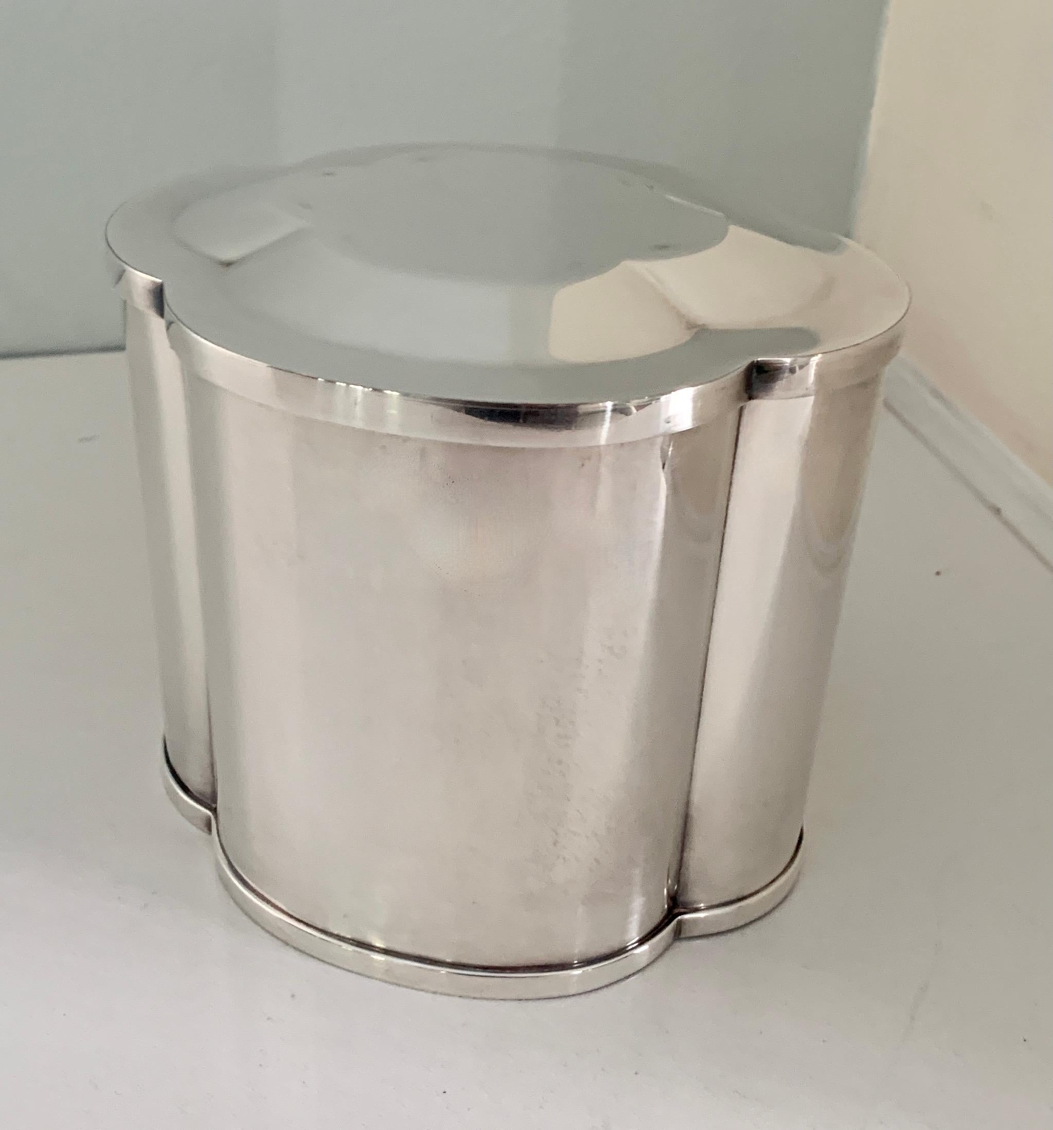 Silver Quatrefoil Brazilian tea caddy - A wonderful caddy, simple and straightforward, with a Silver Quatrefoil design. The lid fits snug and, due to the Elegant, yet plain lines, this piece compliments any decor, from traditional to ultra modern.