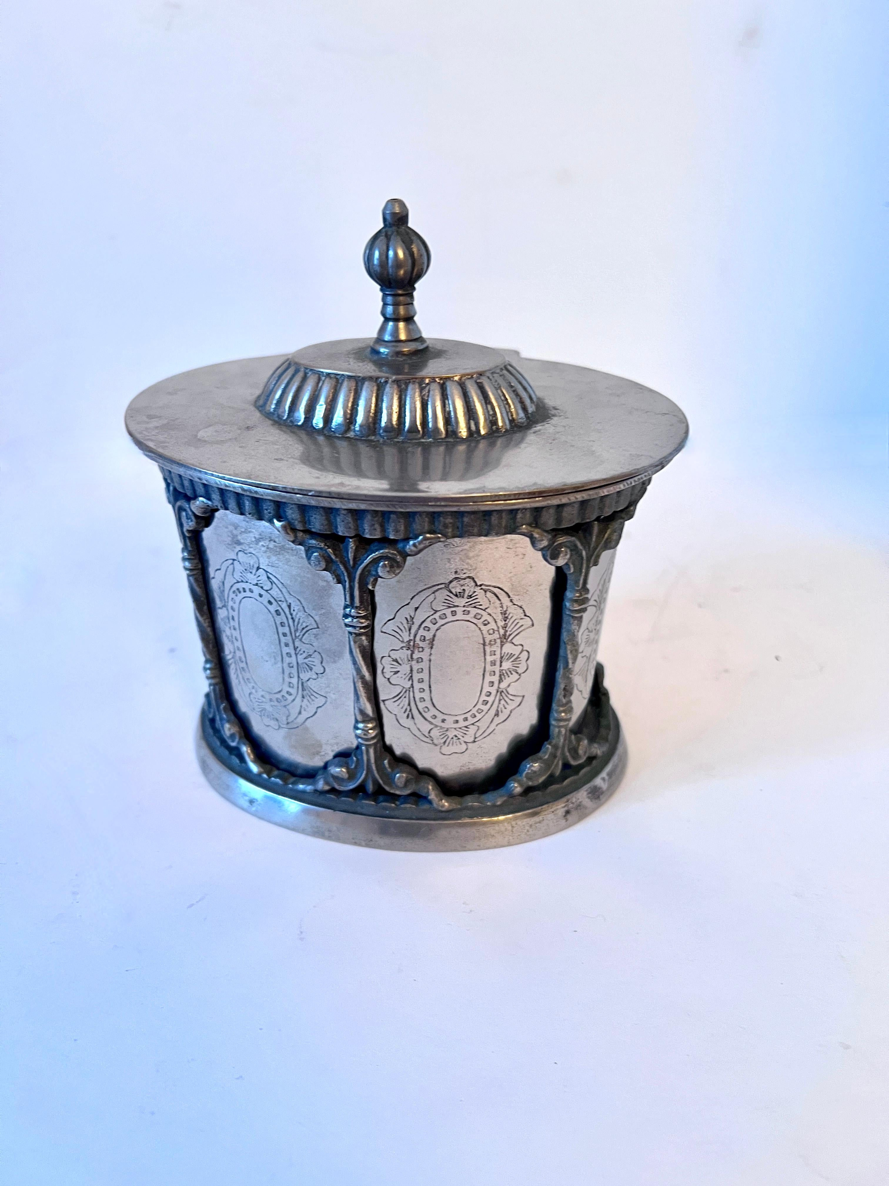 A wonderful Tea Caddy designed to be removed from the ornate framework.  A great piece for tea, tobacco, 420 or useful as at a work station or desk to hold various supplies, also in the bath to hold Q-tips or cotton balls.

Many uses, and