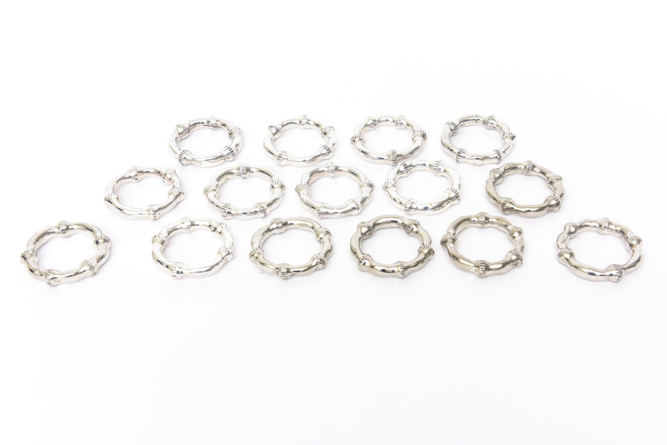 This set of 15 vintage napkin rings are of the bamboo design 10 of them are silver plate and the other 5 are nickel silver. We discovered that after we acquired them. They will not be noticeable of the difference in silver as you entertain. They all