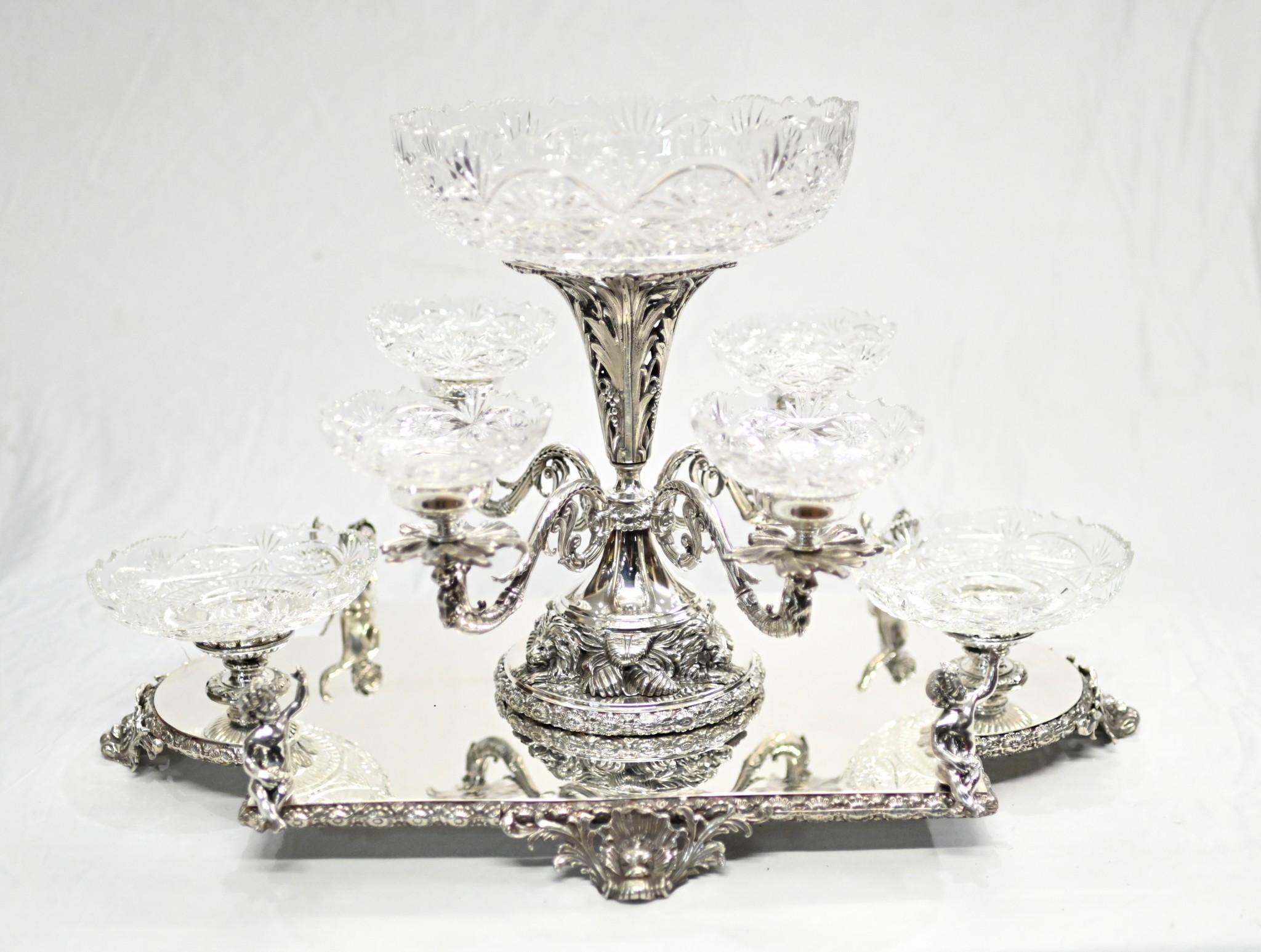 Elegant Sheffield silver plated epergne with glass dishes
Features the main centre bowl and six smaller side dishes
Great for an elegant dinner setting - a high end dinner party - to serve sweets and side dishes
Stands on the mirrored tray stand