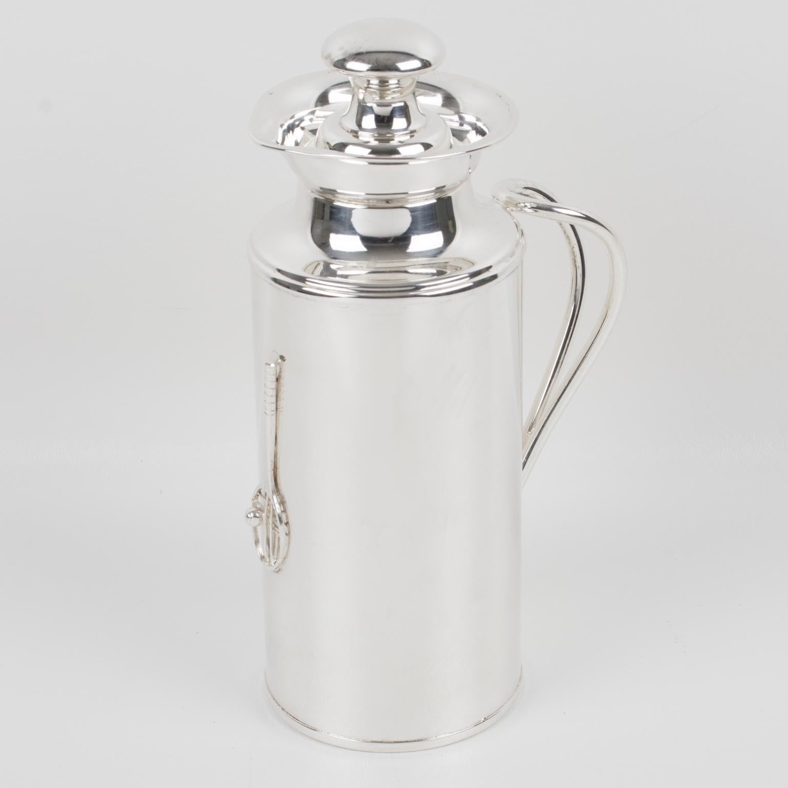This streamlined Italian silver plate barware thermos or insulated decanter features a sleek and modernist design. The insulated carafe is made from silver plate metal. This bar accessory has a rounded shape ornate with double handles and a tennis