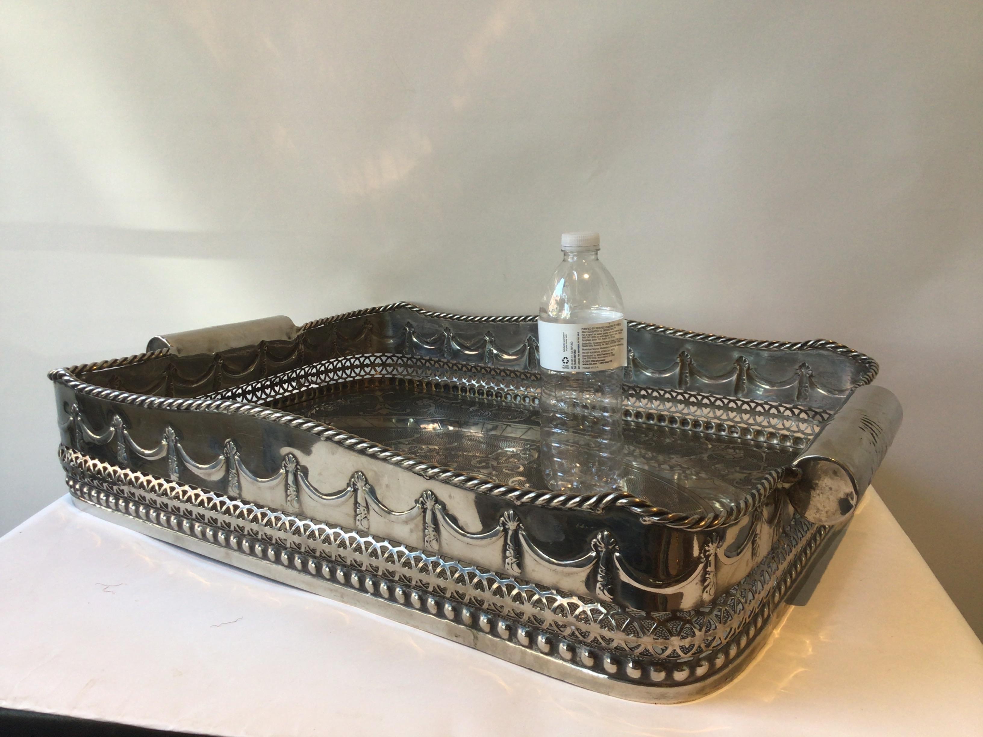 Silver plate tray with high gallery.