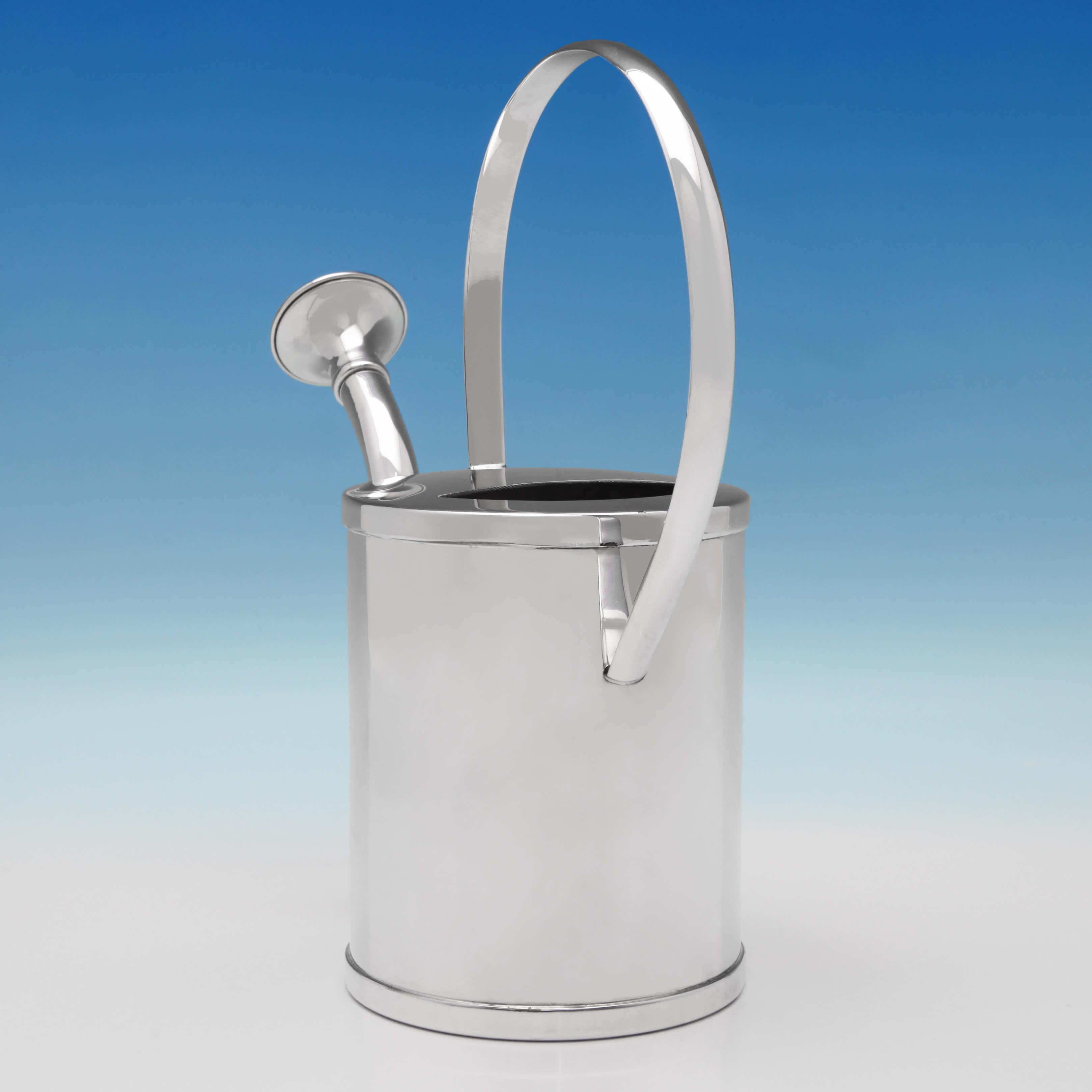 Made in London circa 1950 by Asprey & Co. Ltd., this fun and desirable silver plate watering can is functional as well as beautiful. The watering can measures: 10