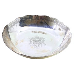 Silver plate with scalloped rim, engraved garlands 
East India Company symbol