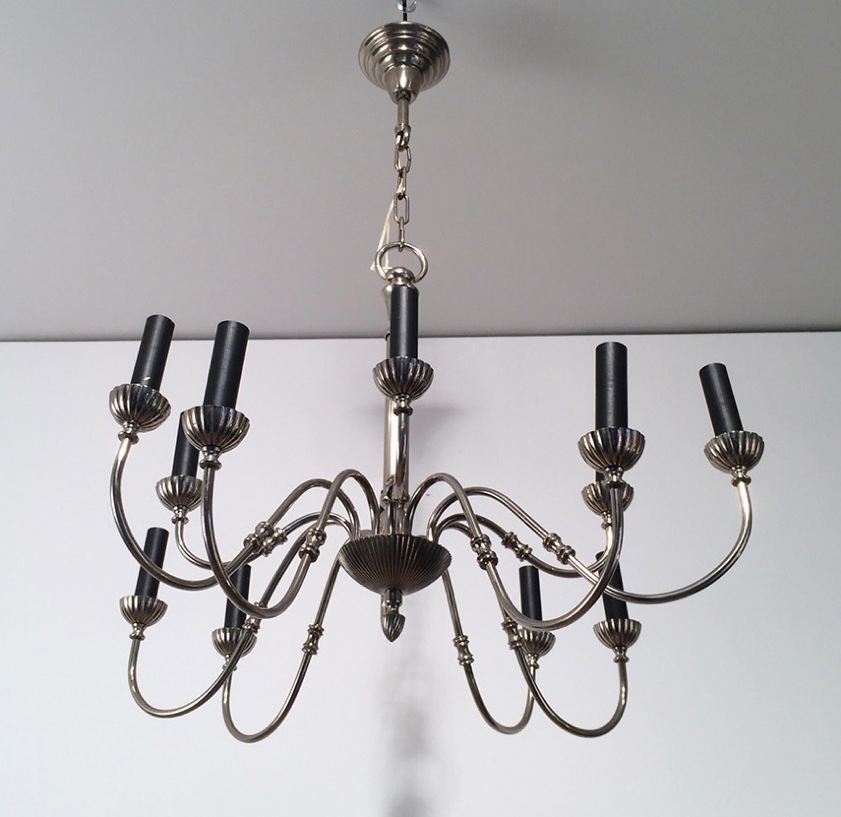This very nice neoclassical chandelier is made of silver plated. This is a very elegant fixture with 12 arms. This is a French work. Circa 1940.
