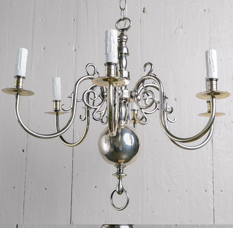 This beautiful chandelier was made in Belgium and was plated in England by prominent antique dealer there. 

It has been re-wired for the US after being imported. 
It is quite simple and beautiful and has a wonderful color to it. 
This style of