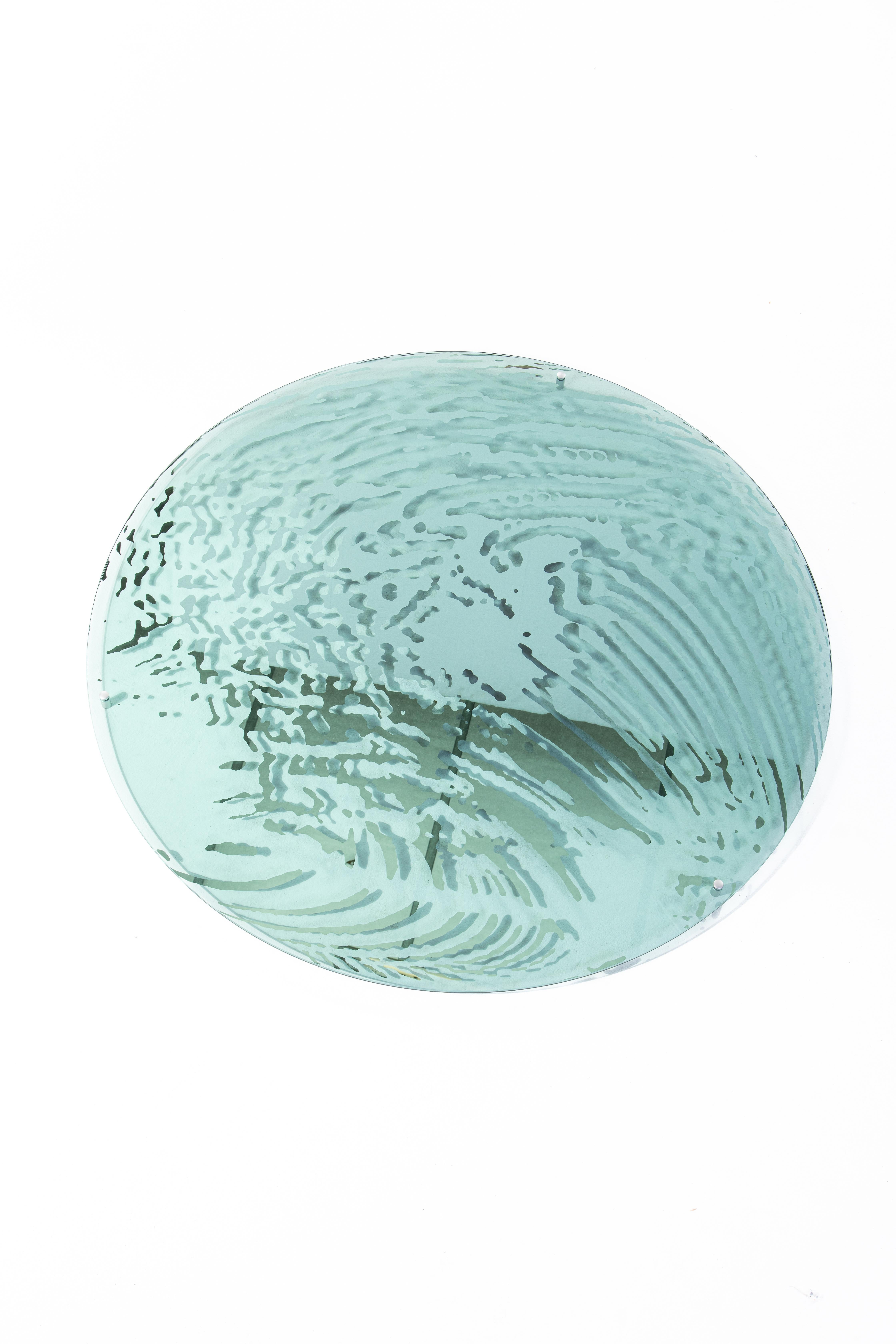 Miroir Bigger Splash, verre coloré et plaqué argent de 13 Desserts
Conçu par Clément ROUGELOT. 

Ces miroirs, dont les motifs aquatiques sont argentés à la main sur du verre teinté, sont le fruit d'une collaboration entre Clément et la graphiste