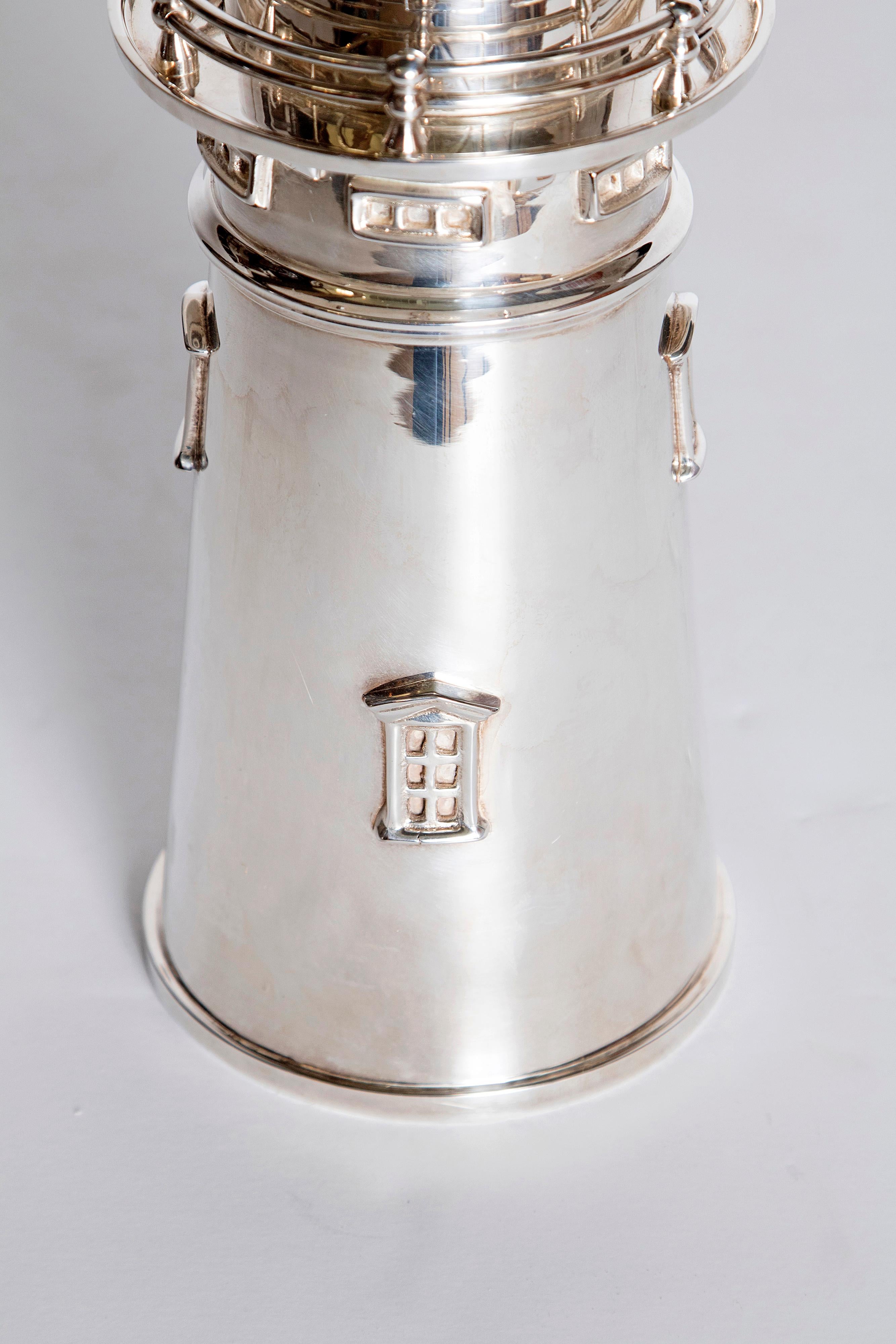 This cocktail/martini shaker is a contemporary copy after the 1927 original by International Silver Co. of Meriden, Connecticut of the 1783 Boston Lighthouse, the second oldest lighthouse in the United States. Details include windows, railings, a