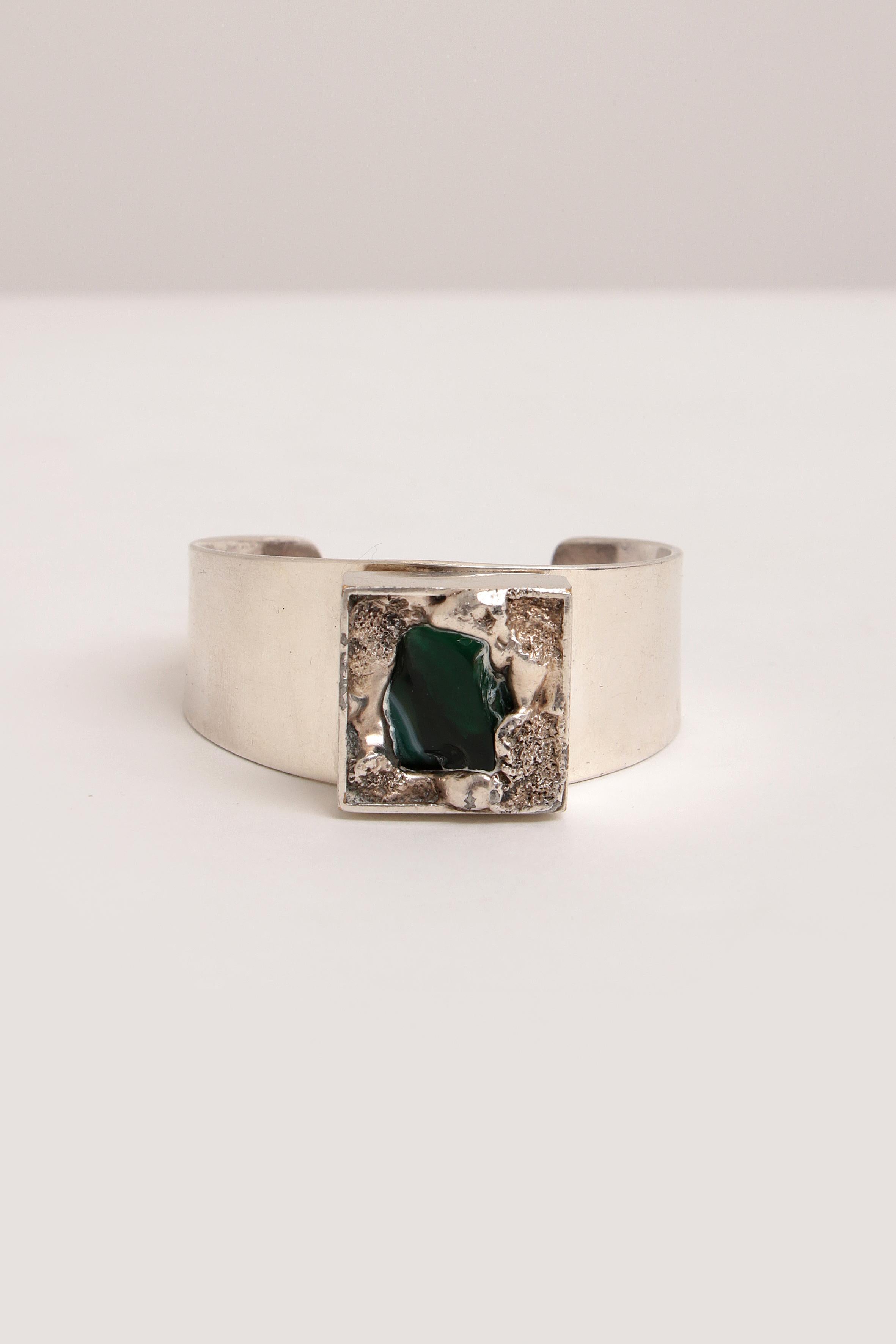 Silver-plated bracelet with glass stone by Dansk Smykkekunst, 1970 Denmark.


This Danish jewelry brand was founded in 1971 and now has one of the largest jewelry collections in Scandinavia. As you would expect from Scandinavian design, this brand