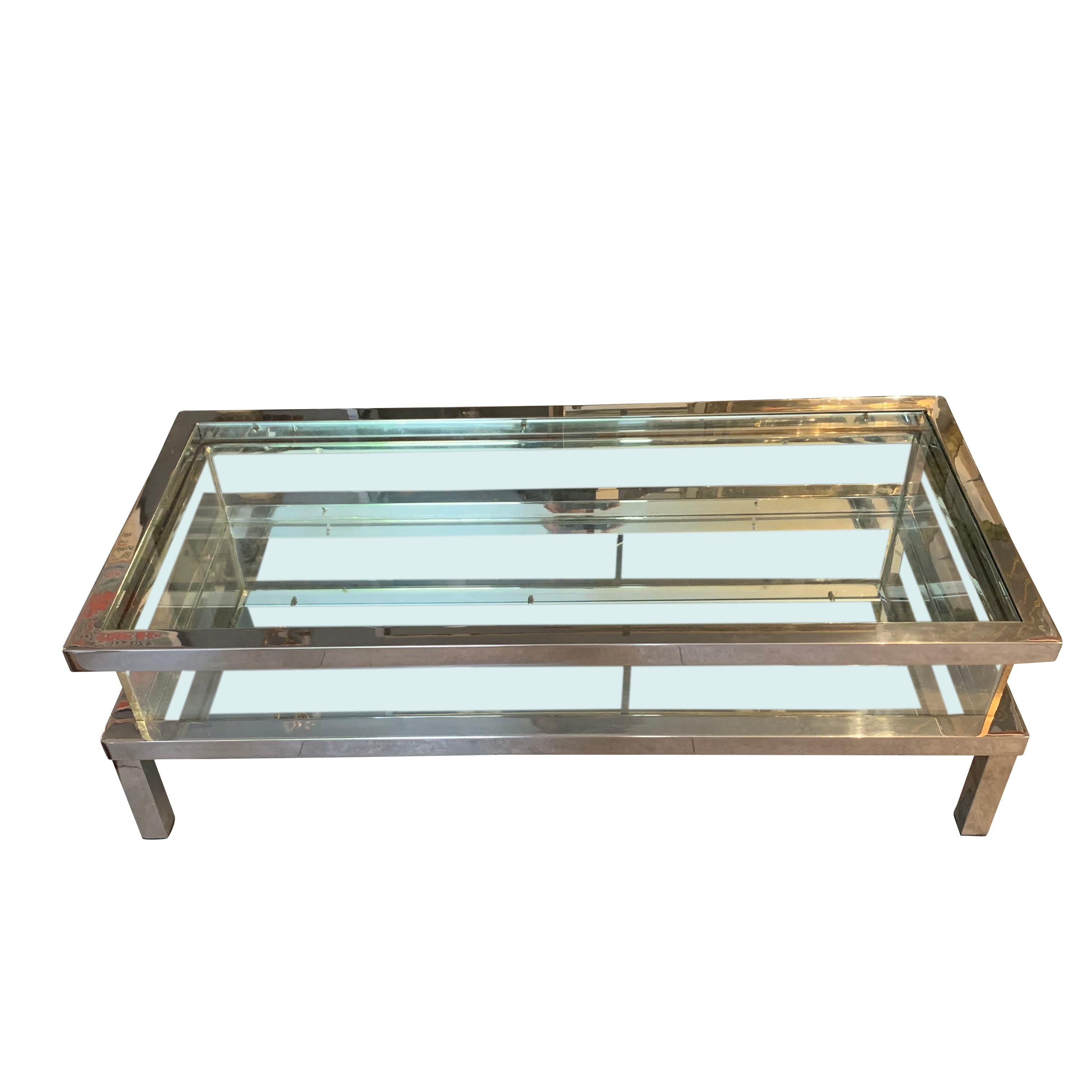 Midcentury French silver plated brass vitrine coffee table
Mirrored lower inner shelf
Top slides halfway open to expose vitrine.
 