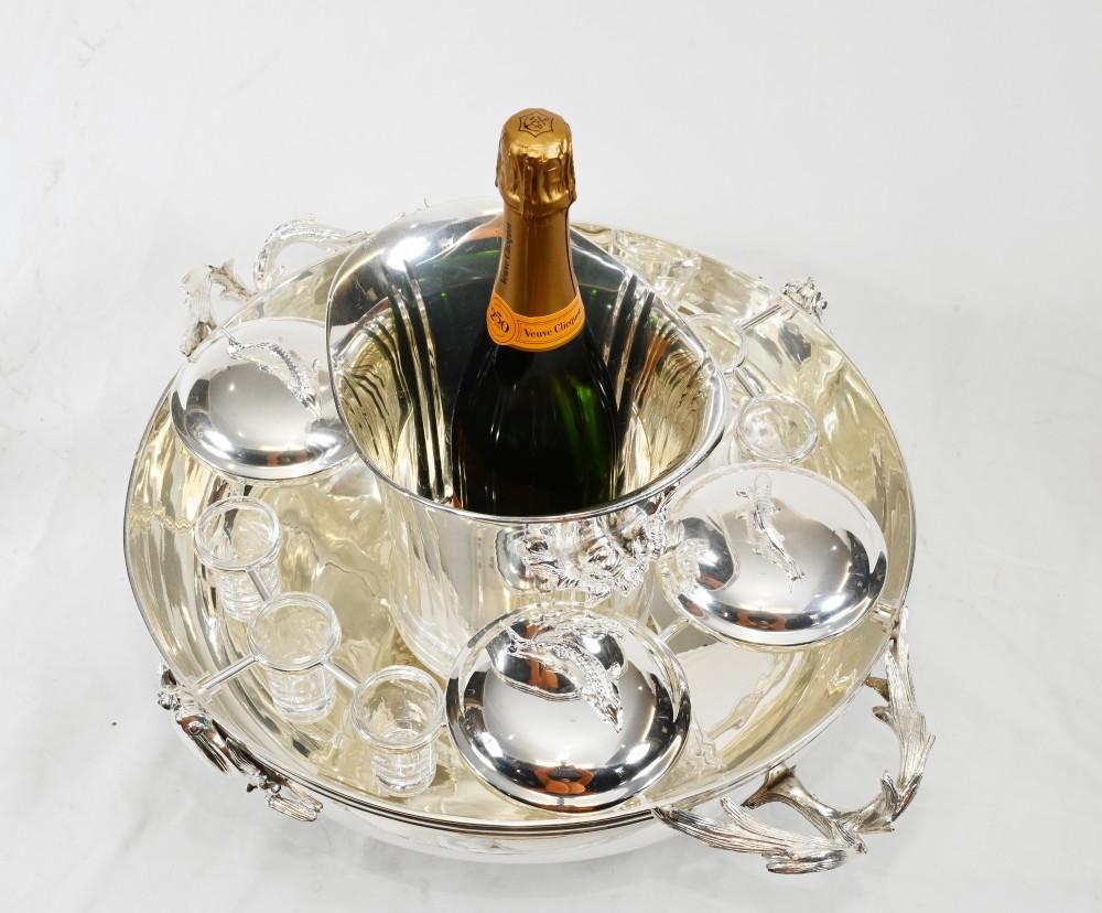 A Very Fine Silver Plated Caviar Server 
The Four Lidded Dishes Consist OF Fish Handles 
The Central Bowl Has Six Vodka Shot Glass that Surround the Ice Bucket
Certainly a Talking Point for any Dining Room Table